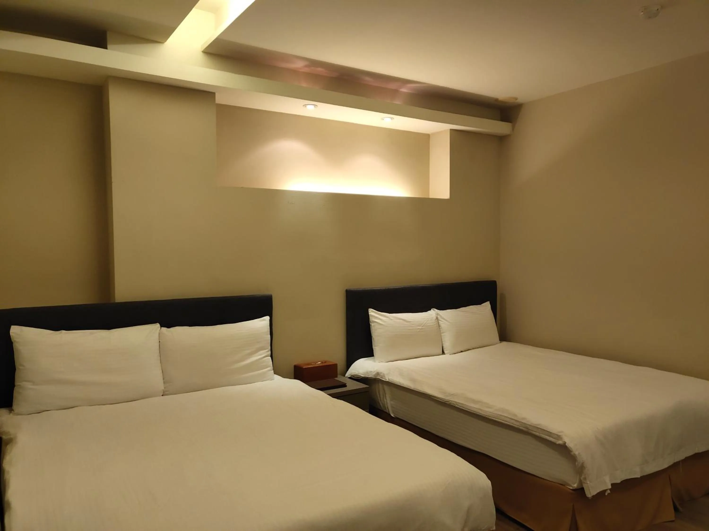 Bed in Empire Pacific Hotel龍潭科學園區 六福村 幼獅工業園區 長租旅居