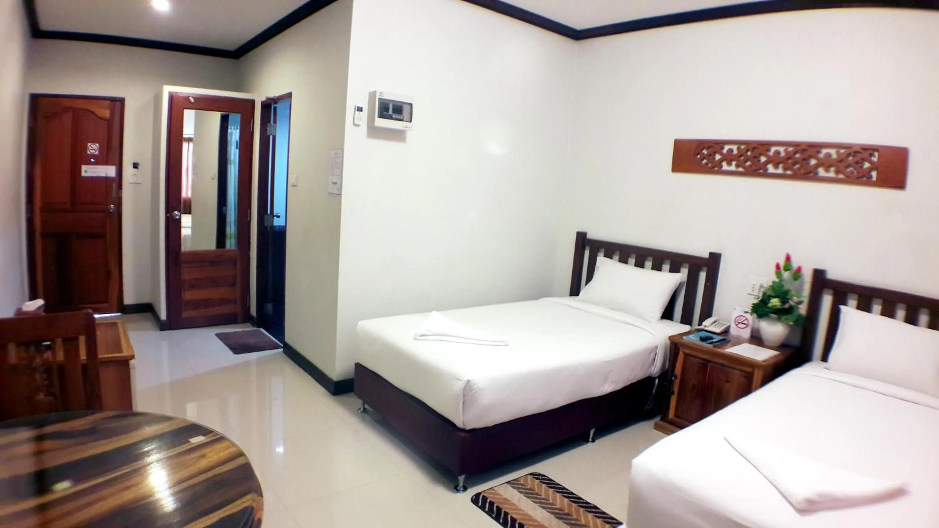 Bed in Khum Nakhon Hotel