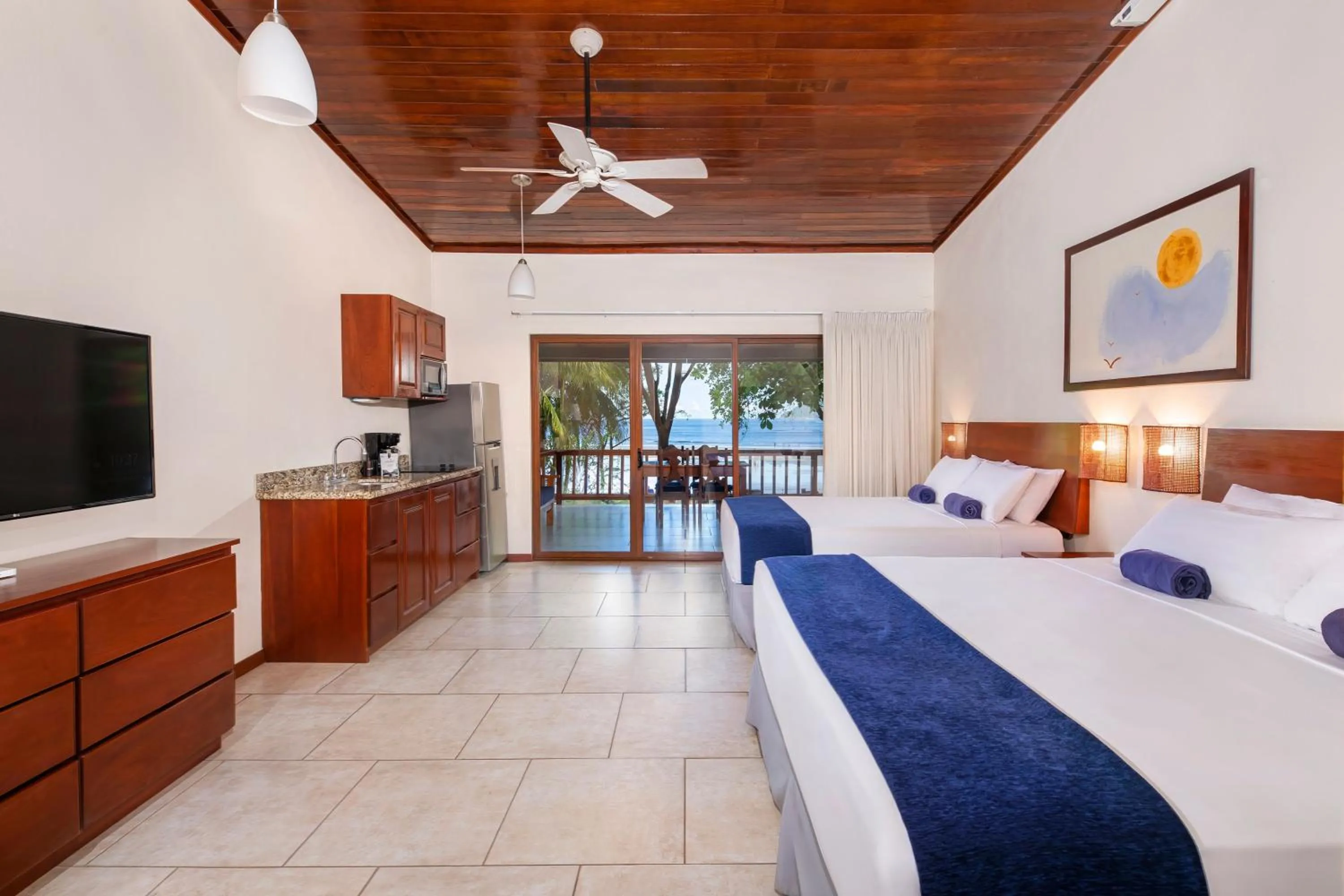 Bed in The Coast Beachfront Hotel