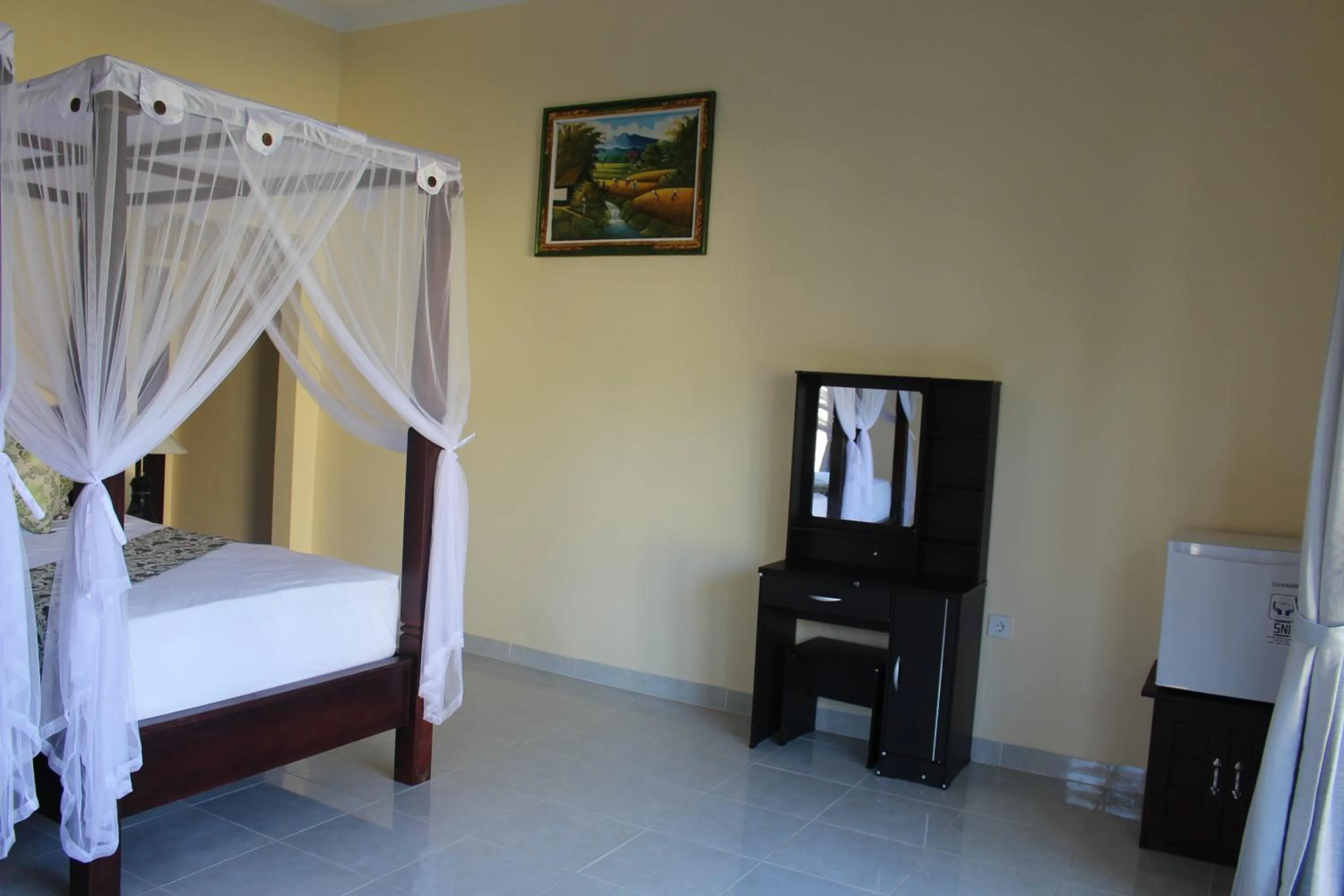 Bed in Bintang Beach Villa