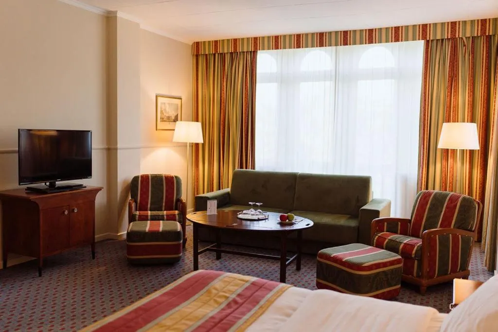 Seating area, Bed in Park Hotel Brussels