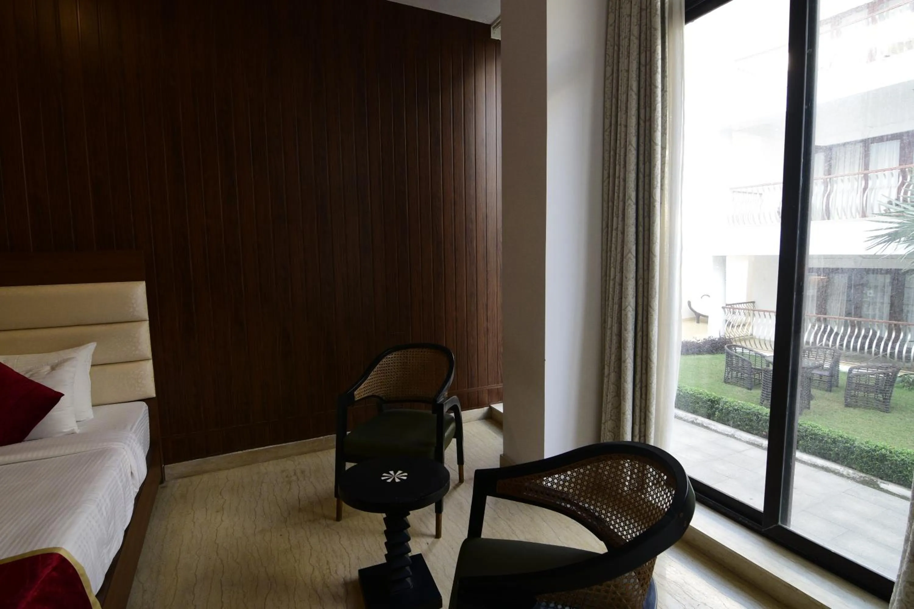 Seating area, Bed in Park Regis Goa