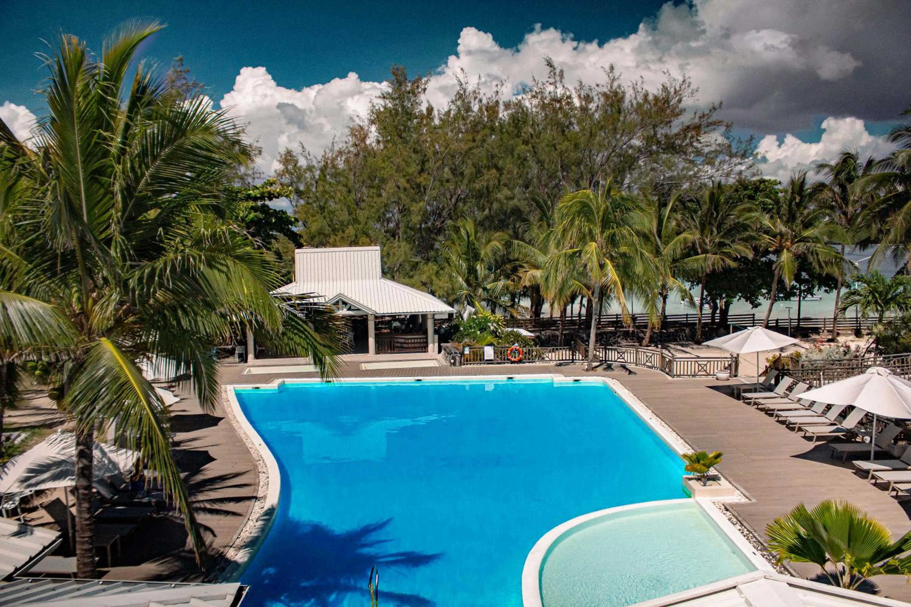 Swimming pool in Le Peninsula Bay Beach Resort & Spa