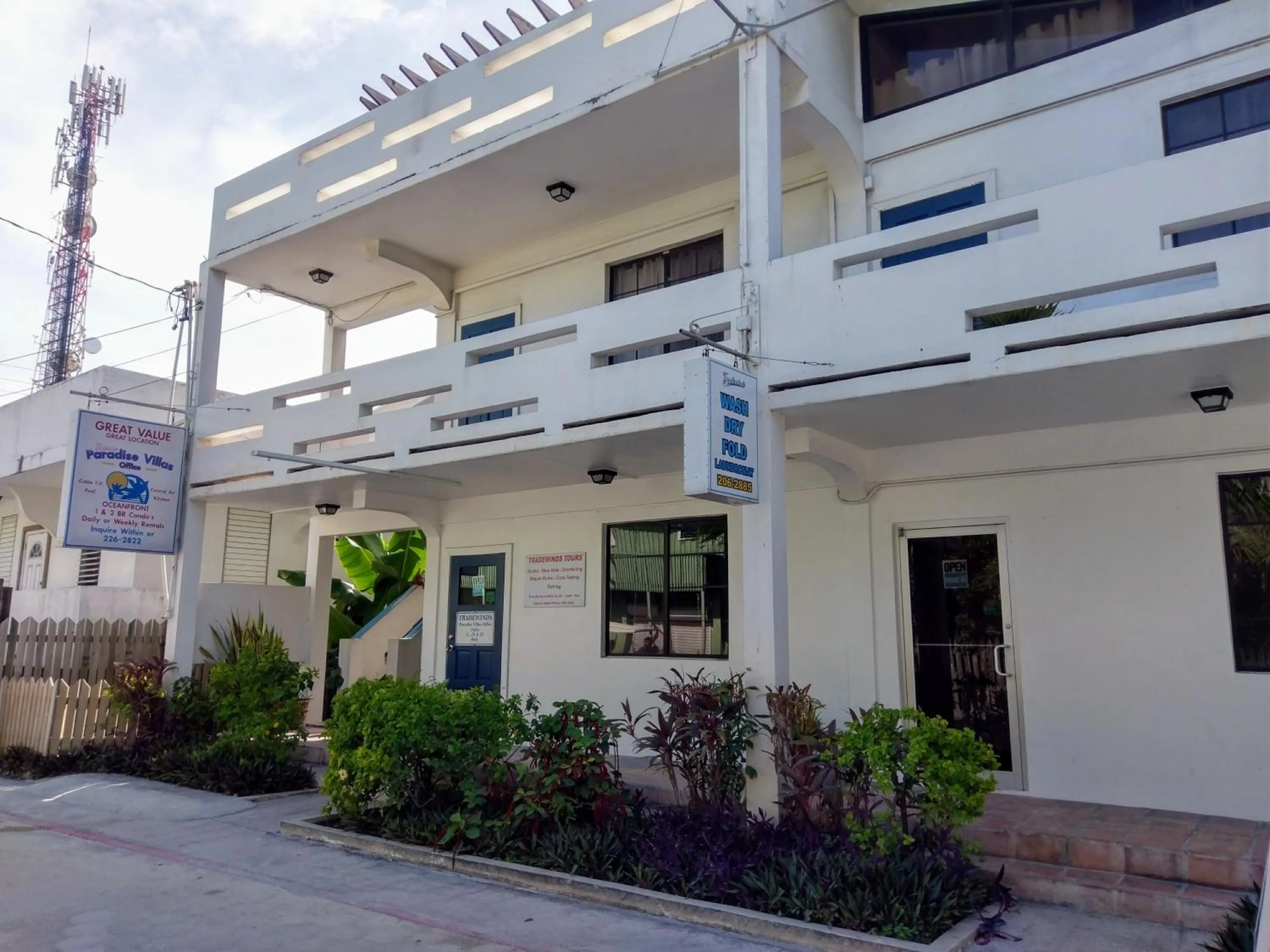 Property logo or sign in Tradewinds Paradise Villas
