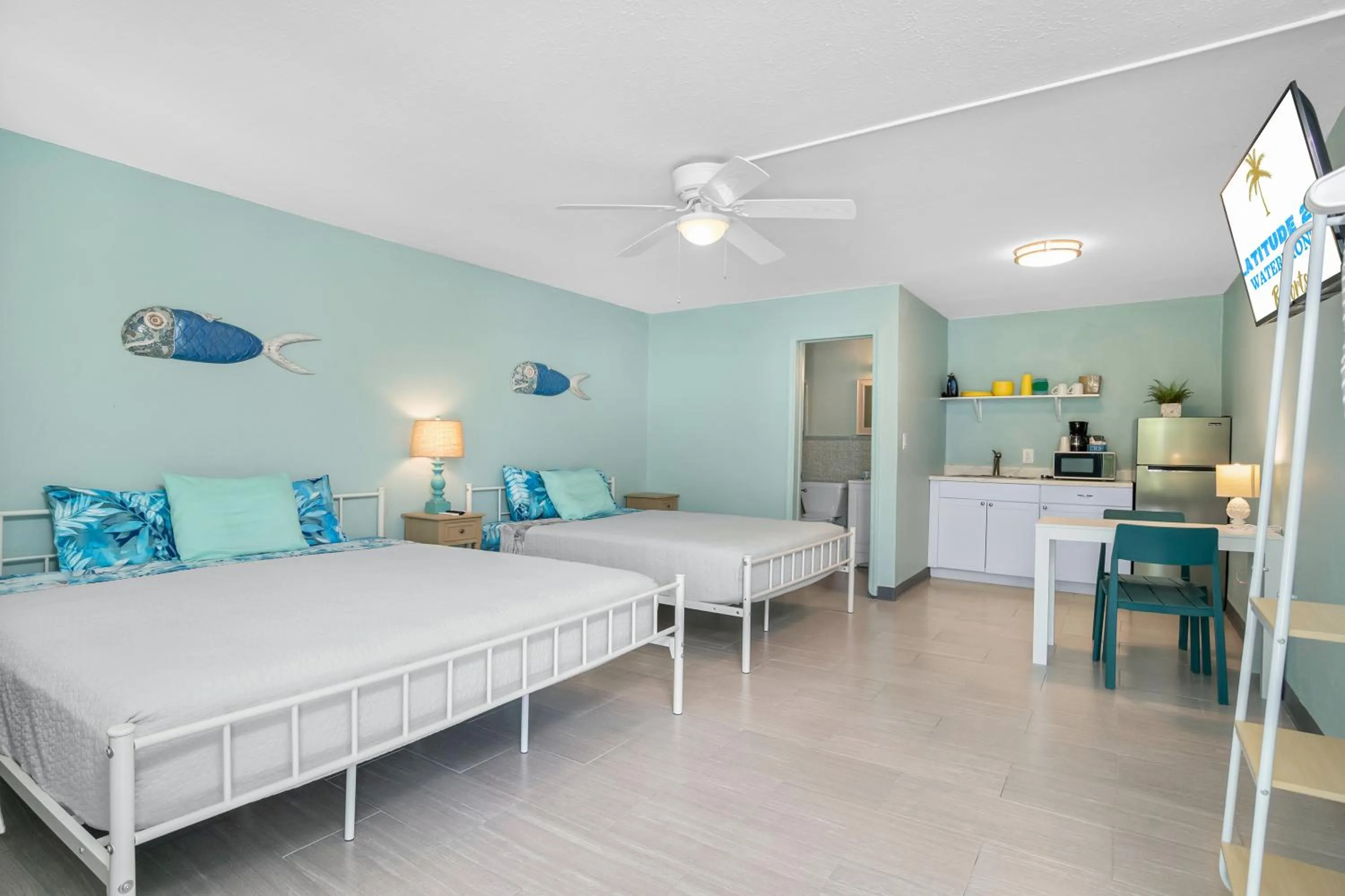Photo of the whole room, Bed in Latitude 26 Waterfront Boutique Resort - Fort Myers Beach