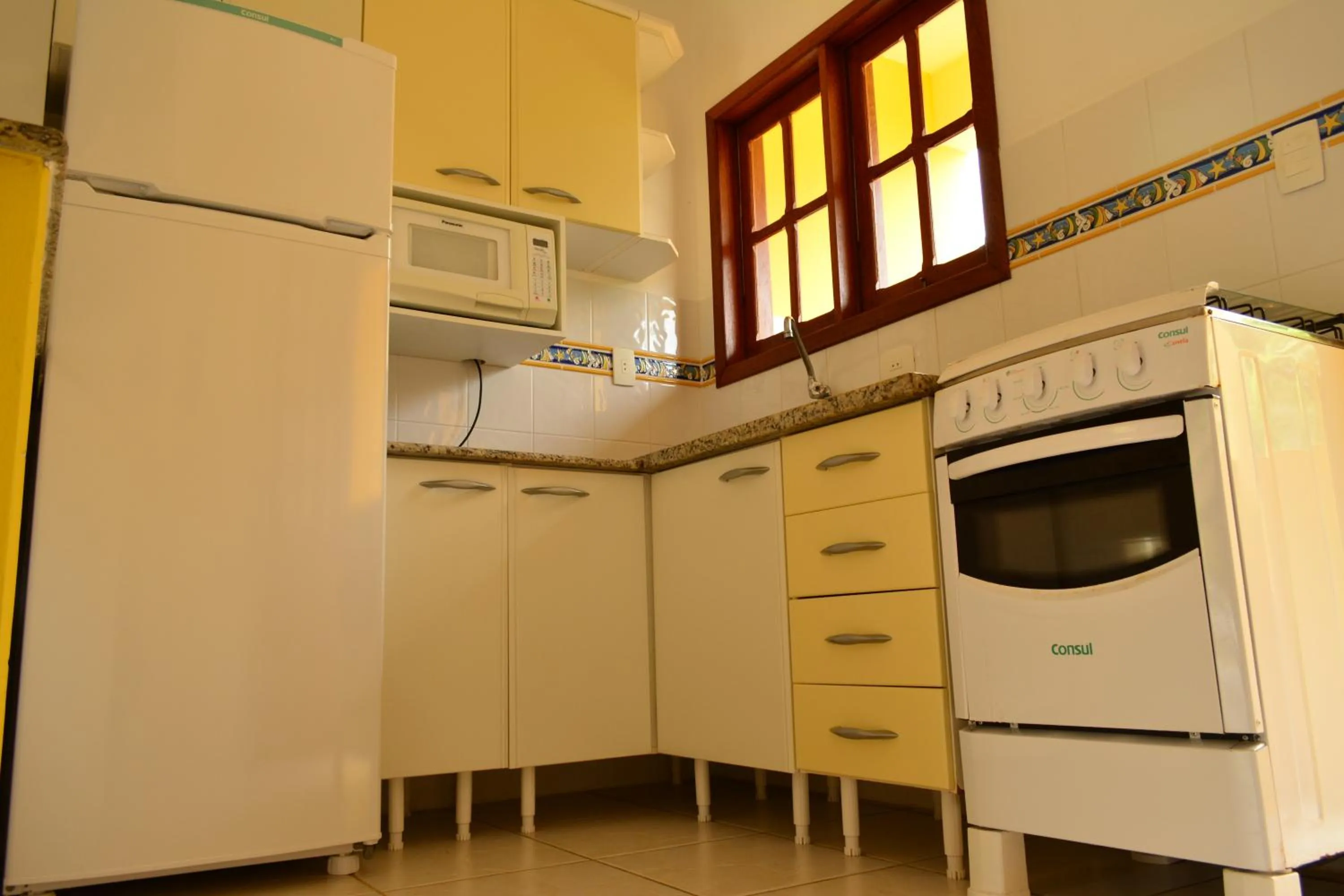 Kitchen or kitchenette in Apartamentos Villa Porto do Sol