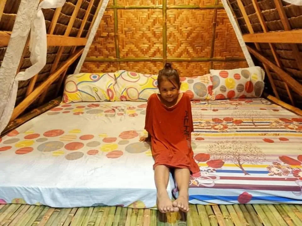 Bed in Moalboal Bamboo Guest House