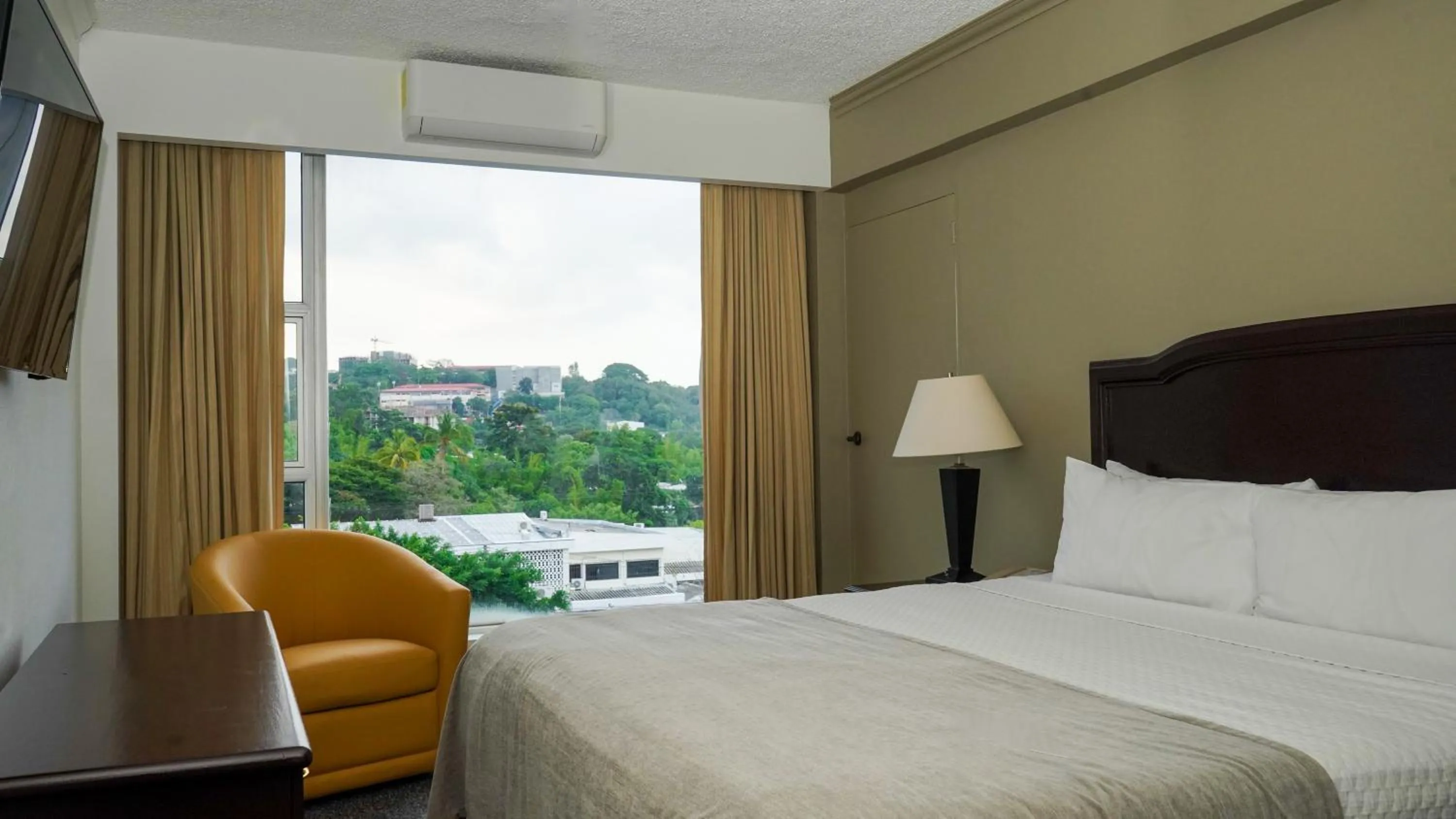 Bed in Plaza Hotel and Suites