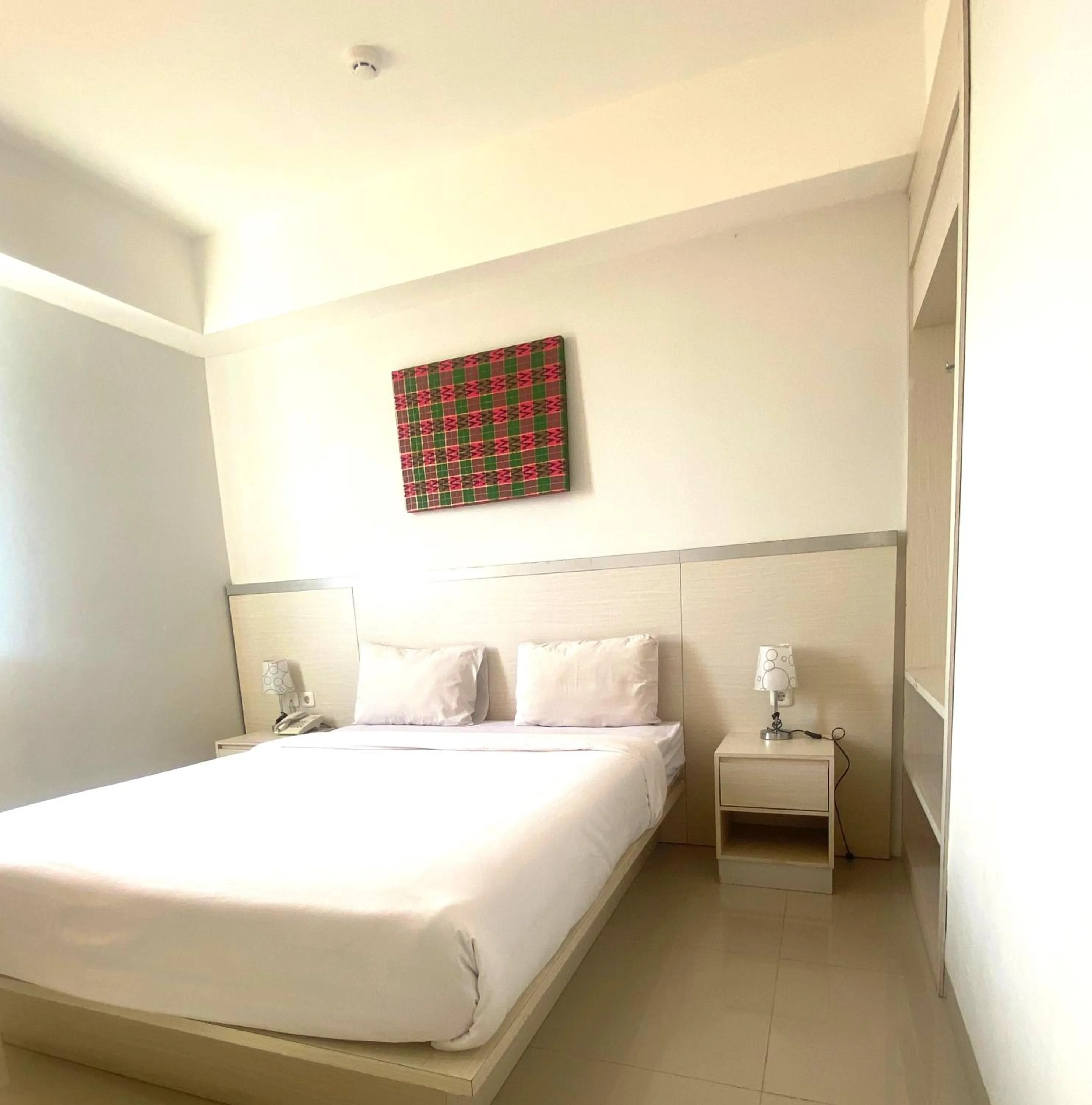 Bed in Liberta Hotel Grand Sayang Makassar