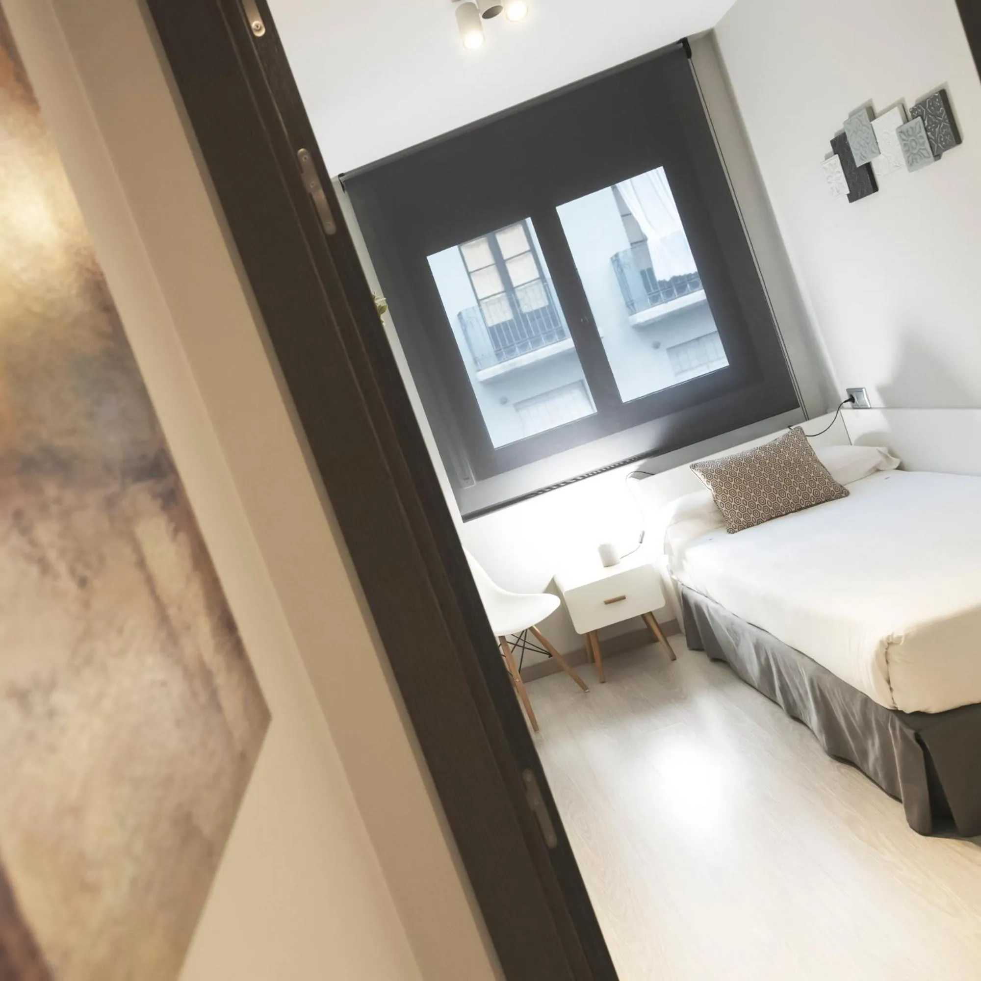 Bed in Apartamentos Real Lleida