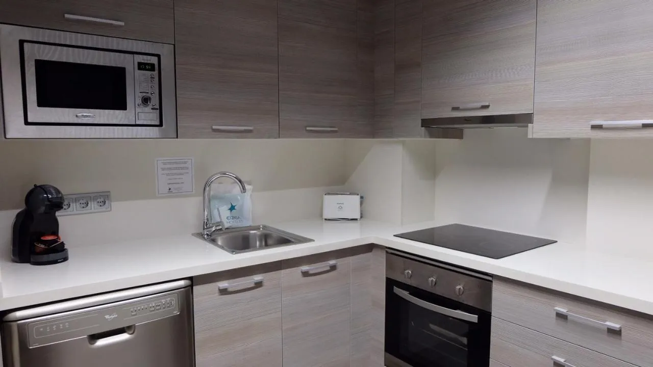 Kitchen or kitchenette in Apartamentos Real Lleida