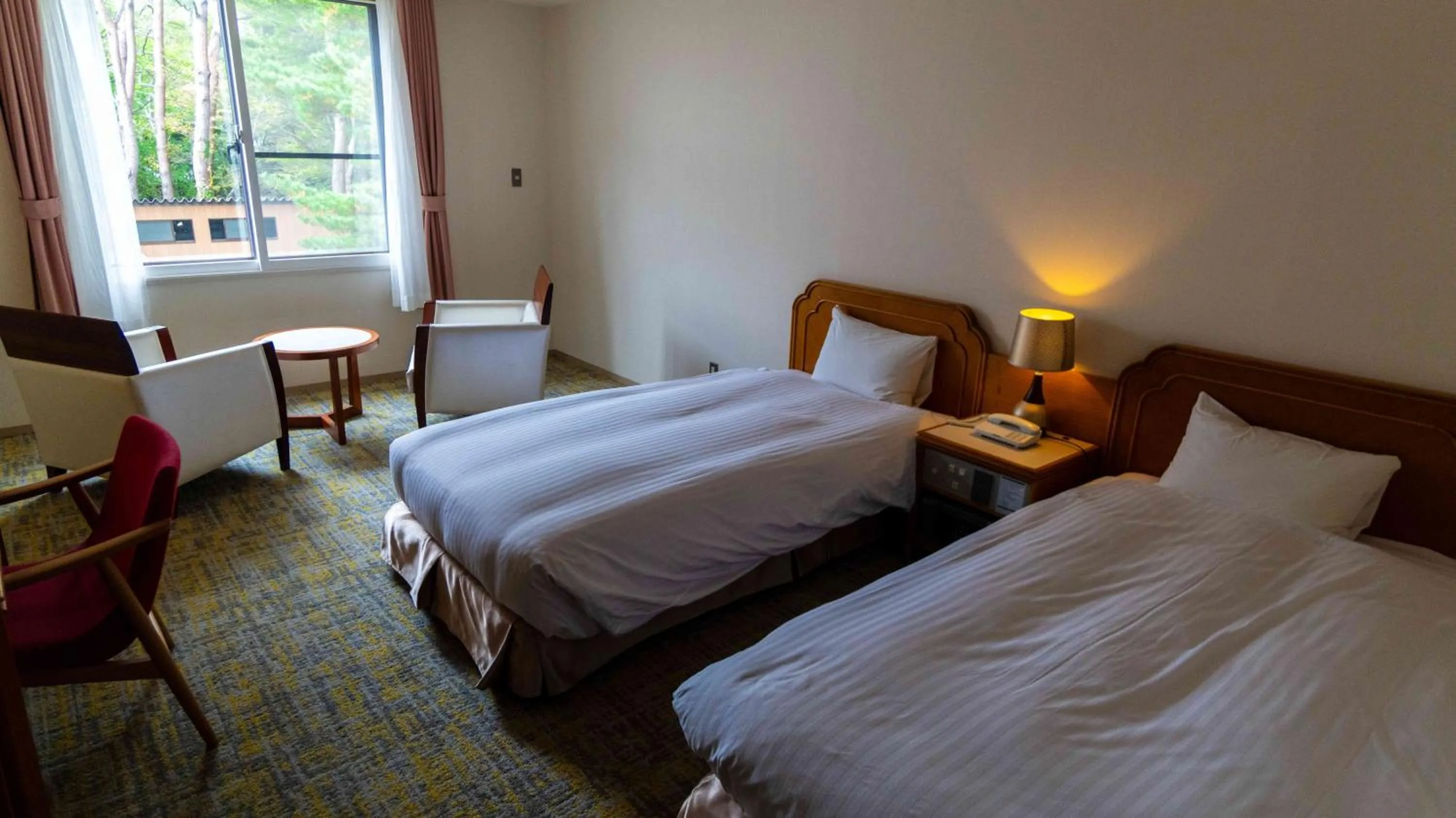 Bed in Motosu Phoenix Hotel