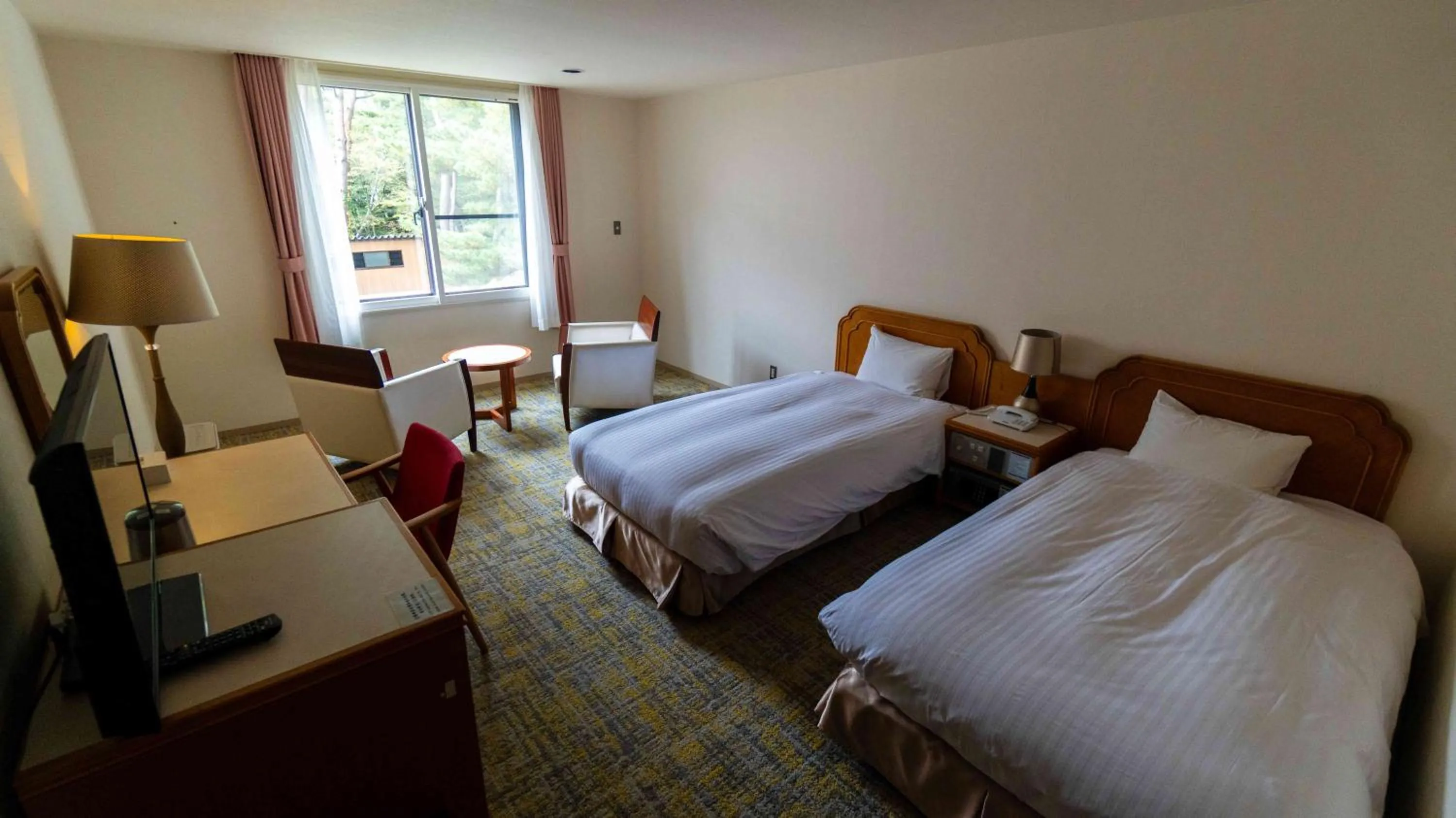 Bed in Motosu Phoenix Hotel