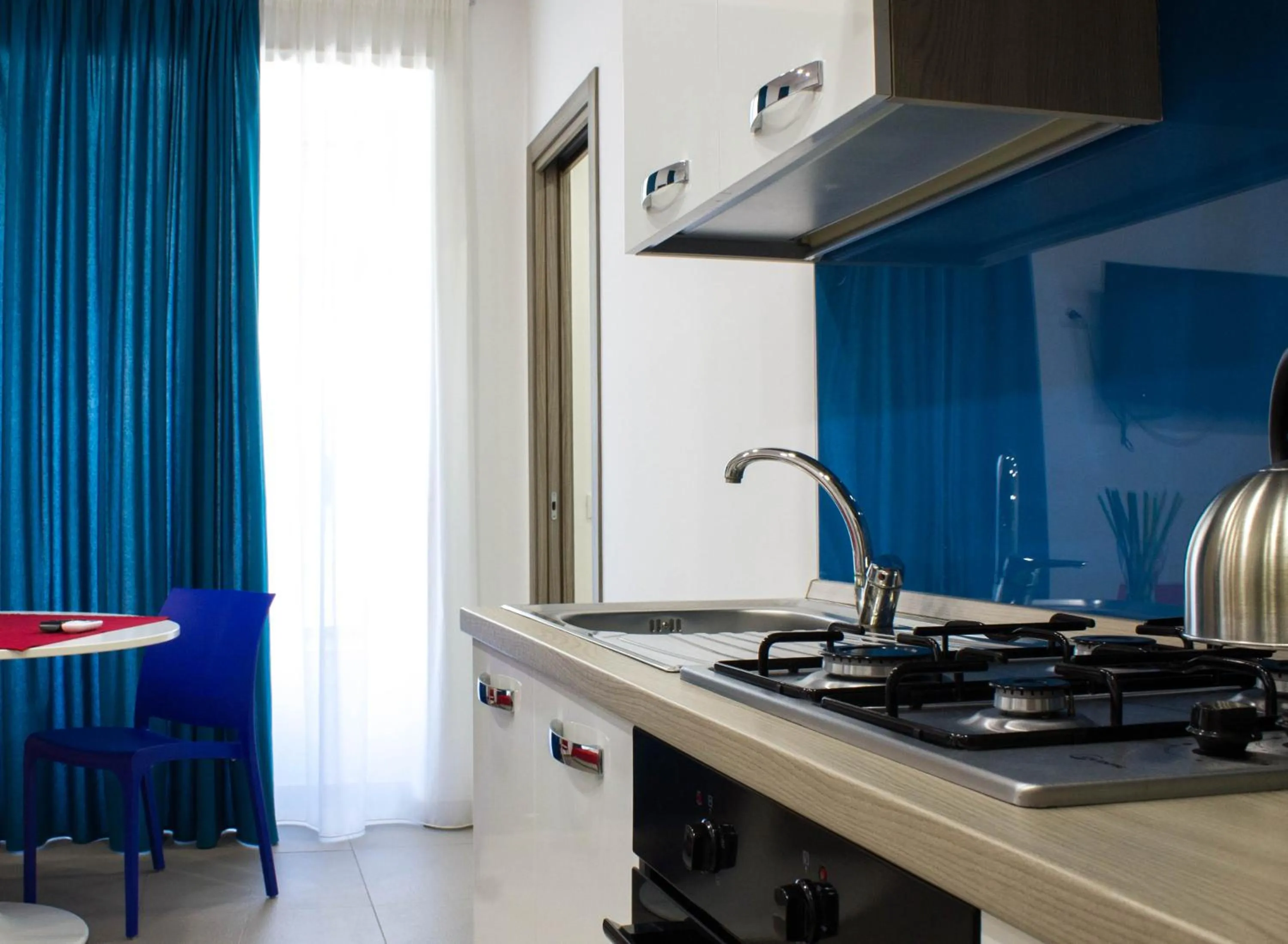 Kitchen or kitchenette in Residence Palazzo dei Delfini by RECEPTIO