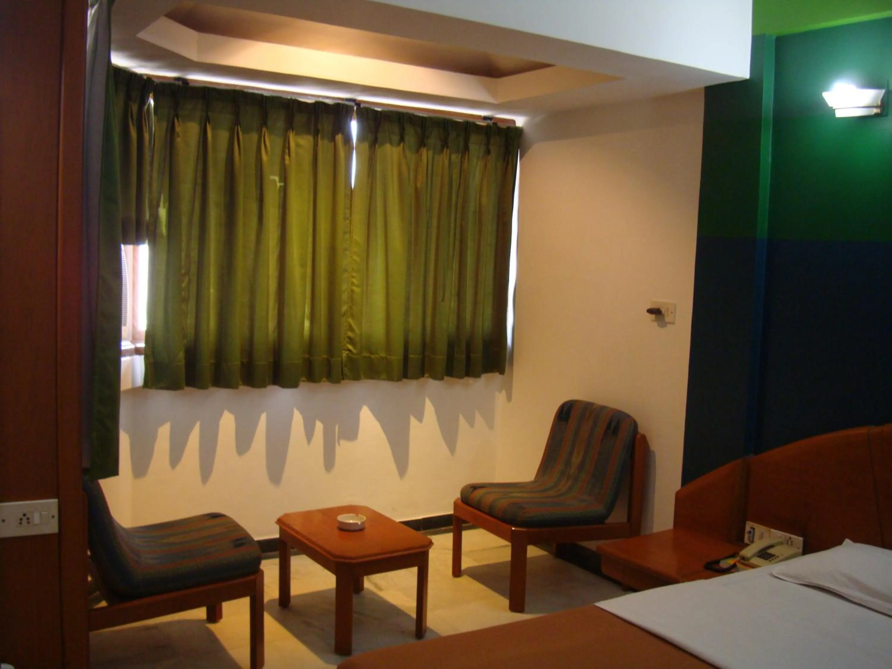 Seating area, Bed in Hotel GRG