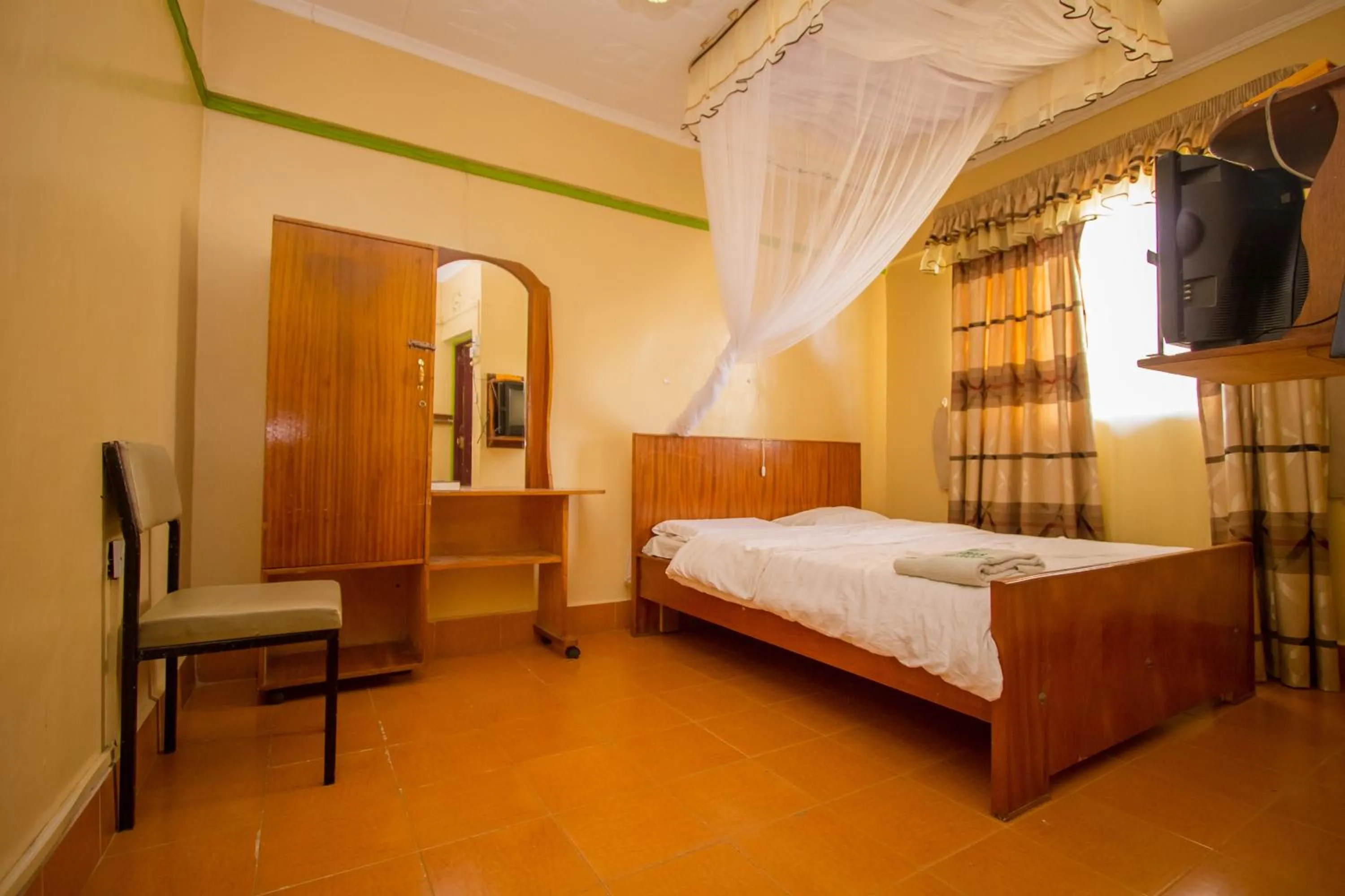 Bed in Jamindas Paradise Motel