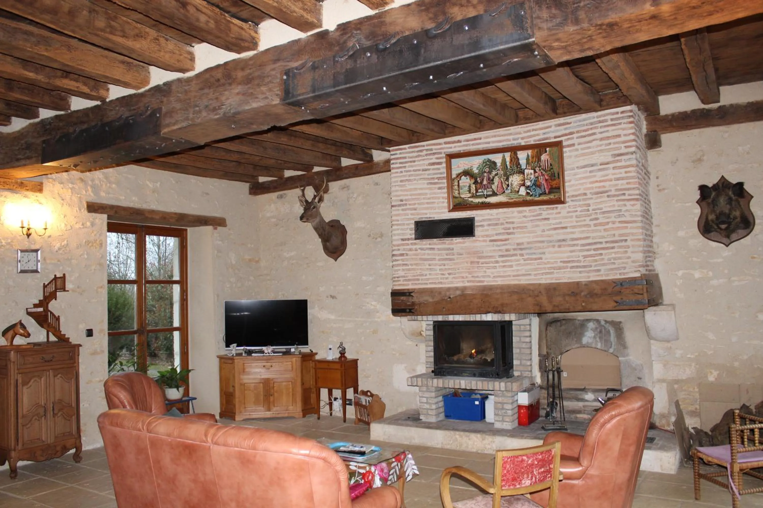 Communal lounge/ TV room in Domaine de la Touche Mosnay