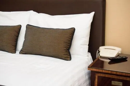 Bed in Rose Court Hotel