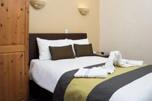 Bed in Rose Court Hotel