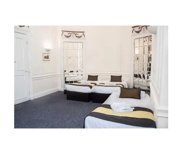 Bed in Rose Court Hotel