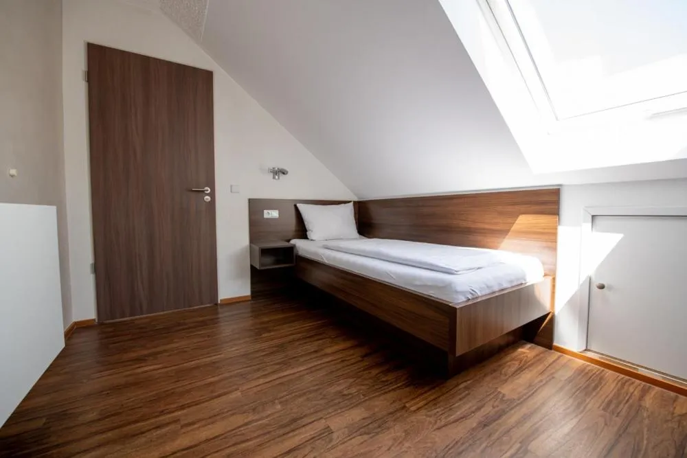 Bed in Garni Hotel Henn