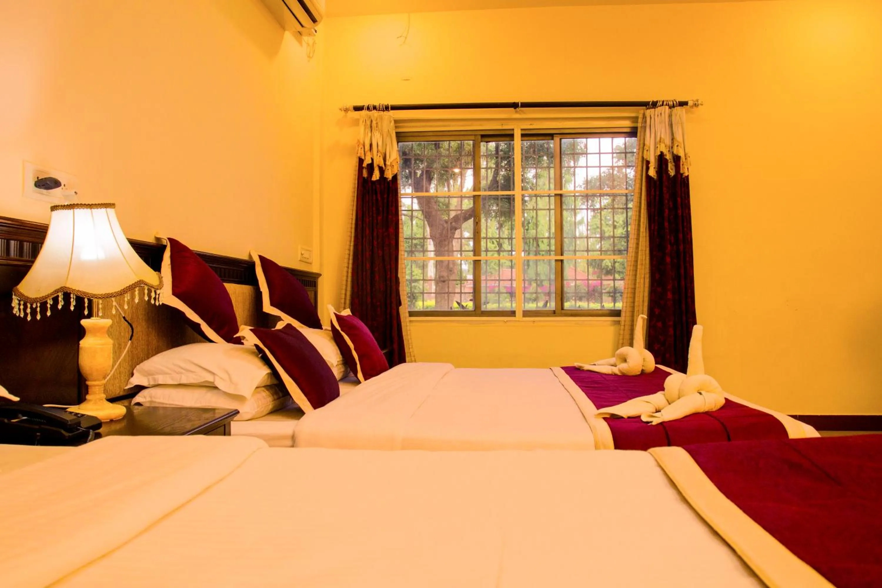 Bed in KSTDC Hotel Mayura Chalukya, Badami