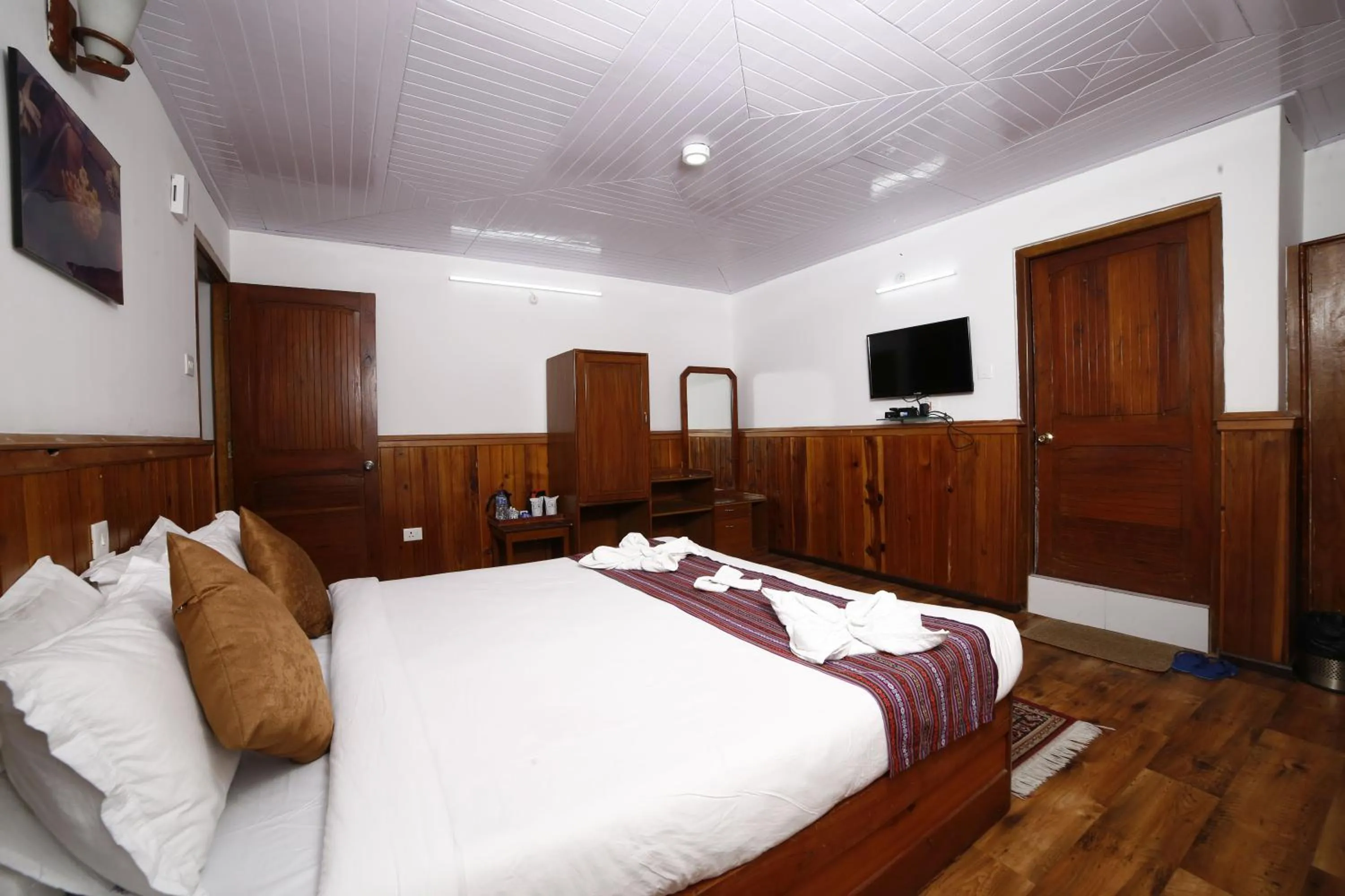 Bed in Yangthang Dzimkha Resort