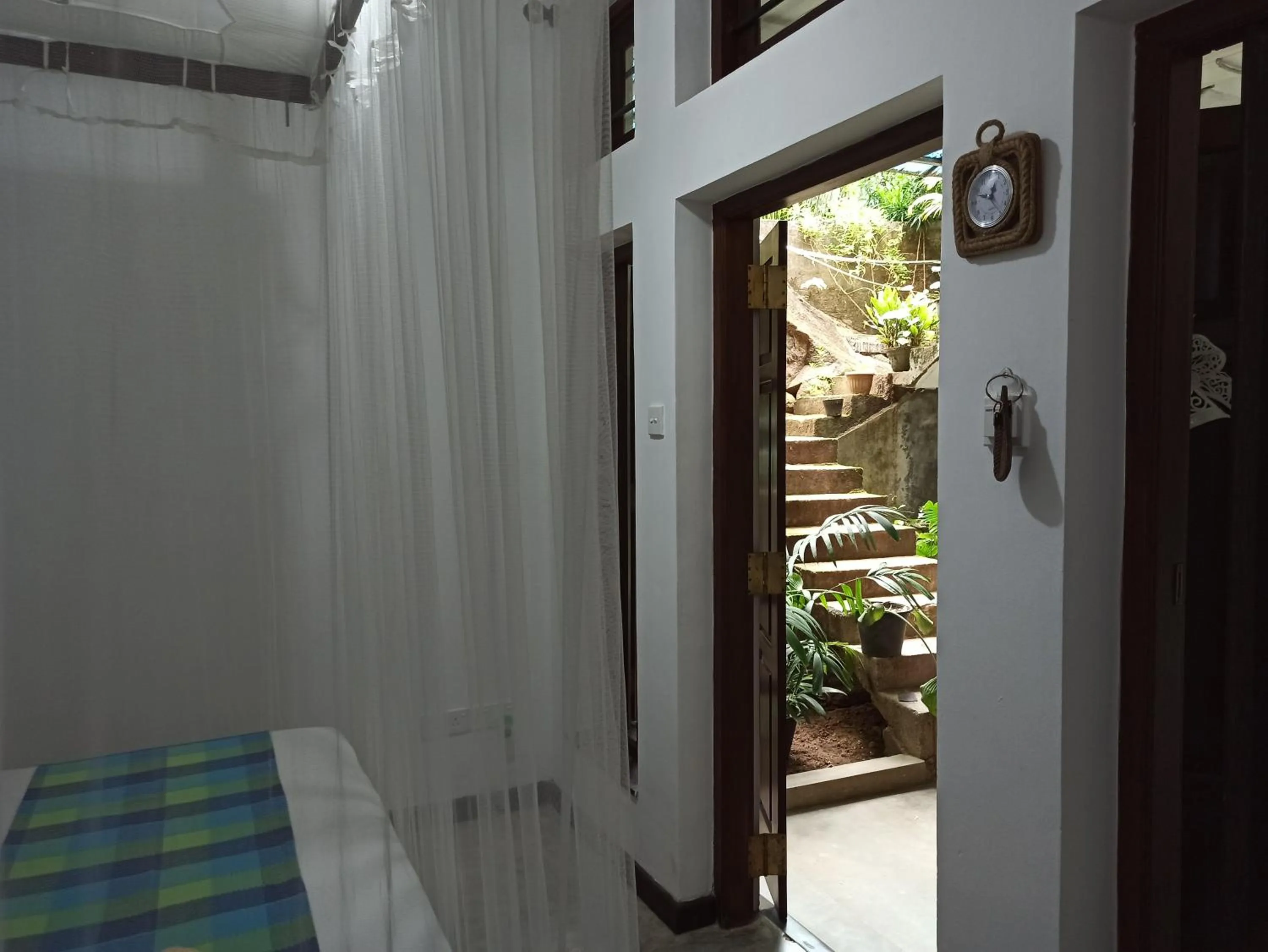 Communal lounge/ TV room, Bed in Butterfly Jewel