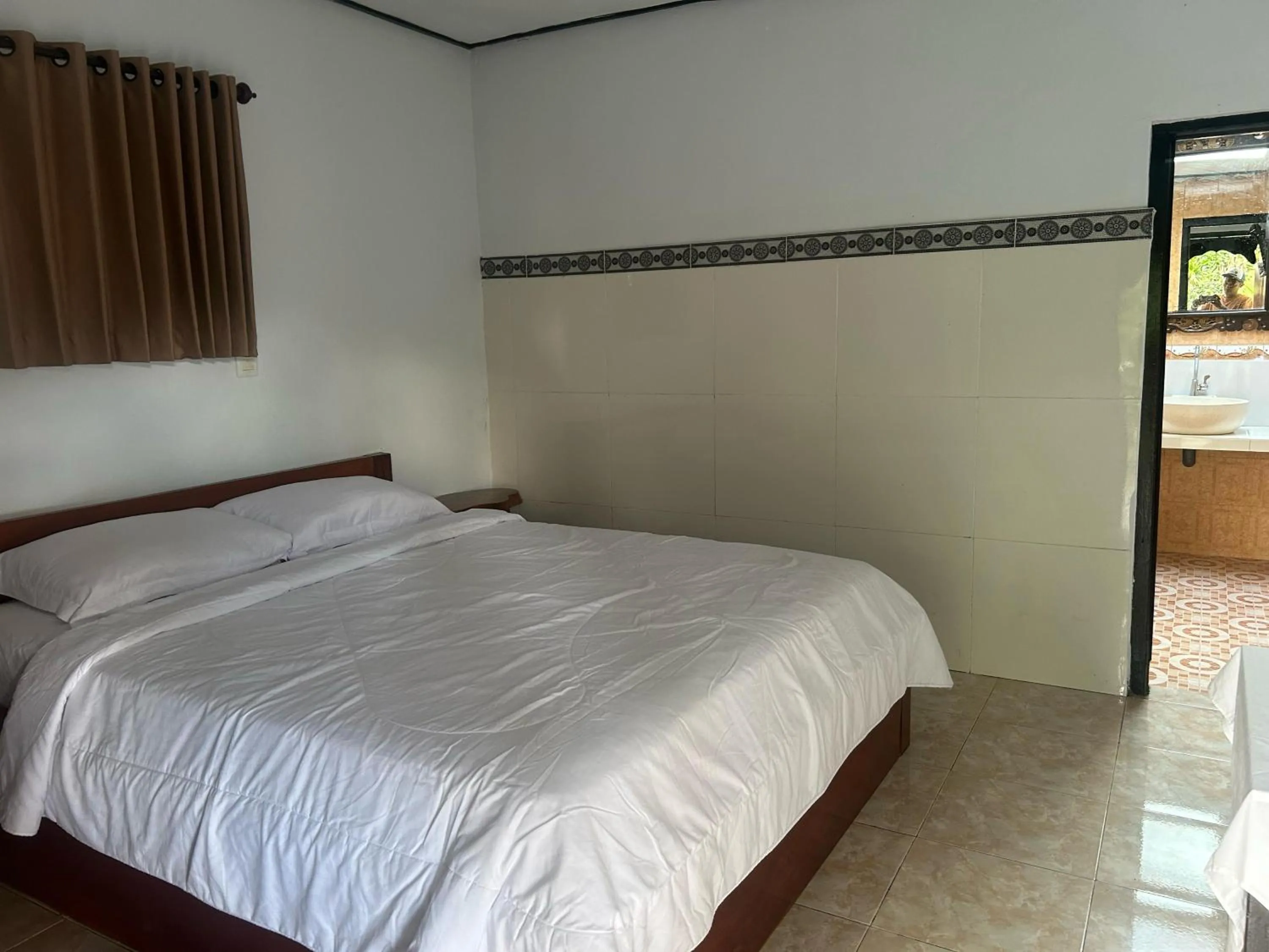 Bed in Darma Putra Hotel