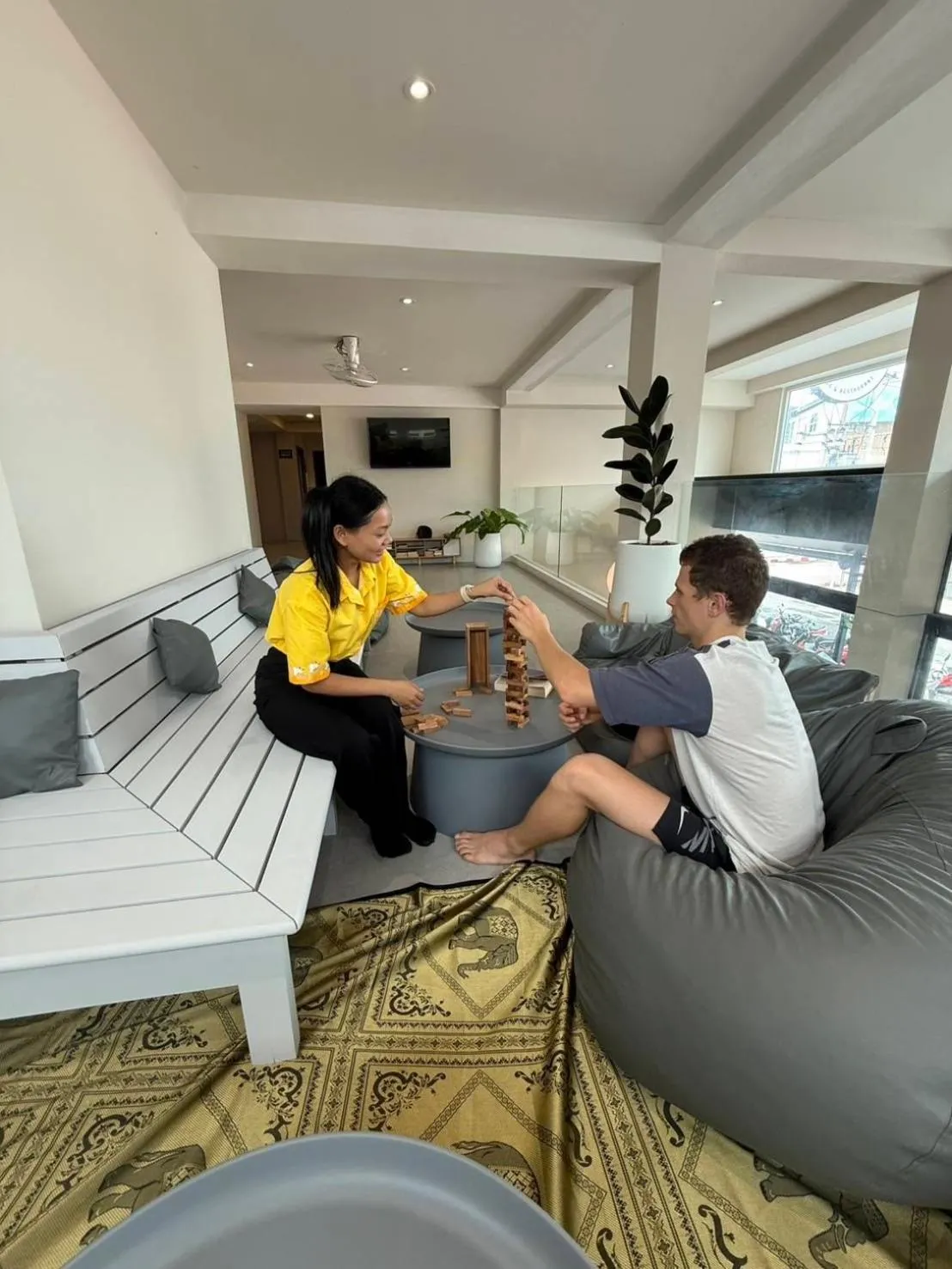 Communal lounge/ TV room in P168 Hostel Samui