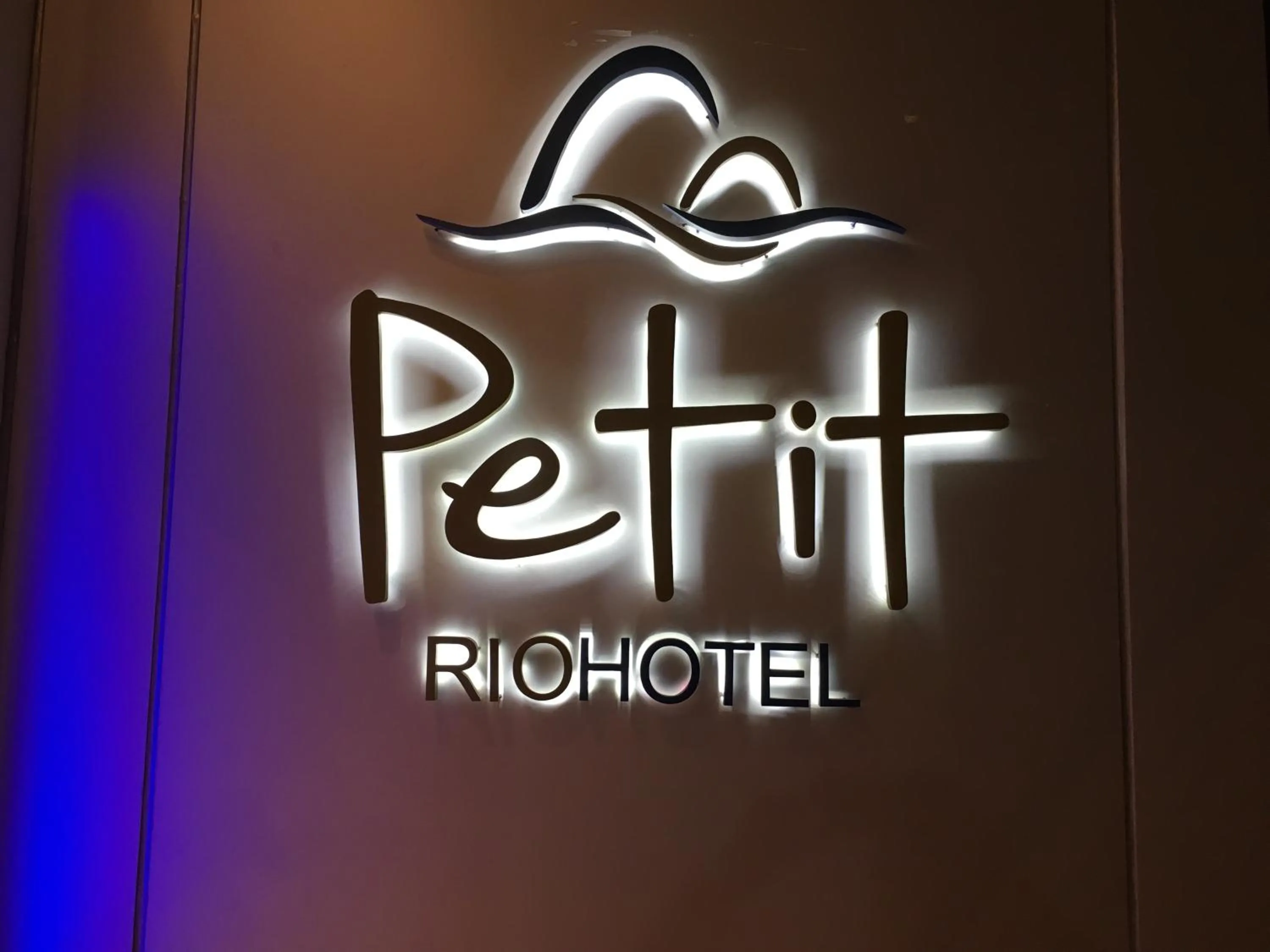 Property logo or sign in Petit Rio Hotel