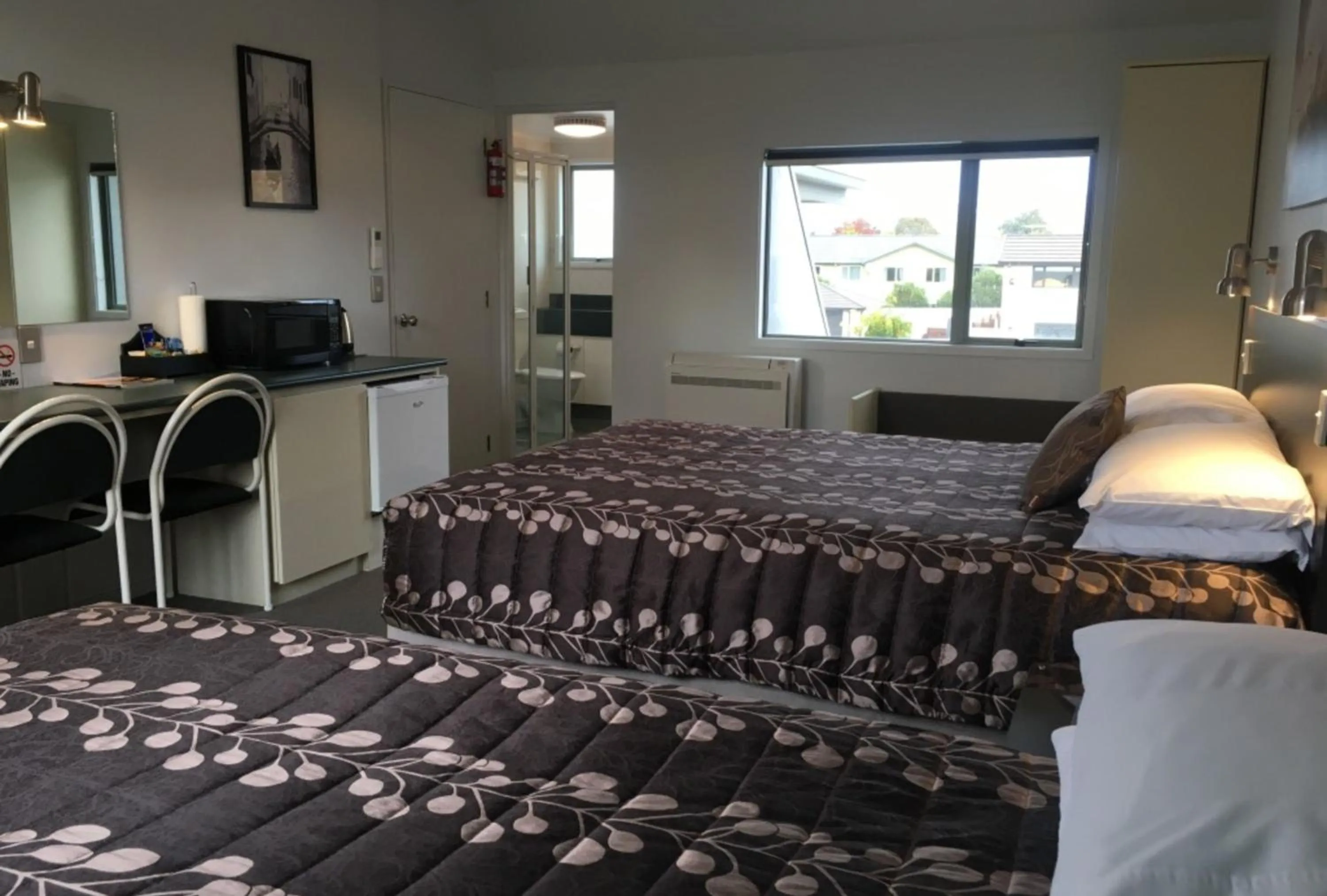 Bed in Colonial Manor Motel