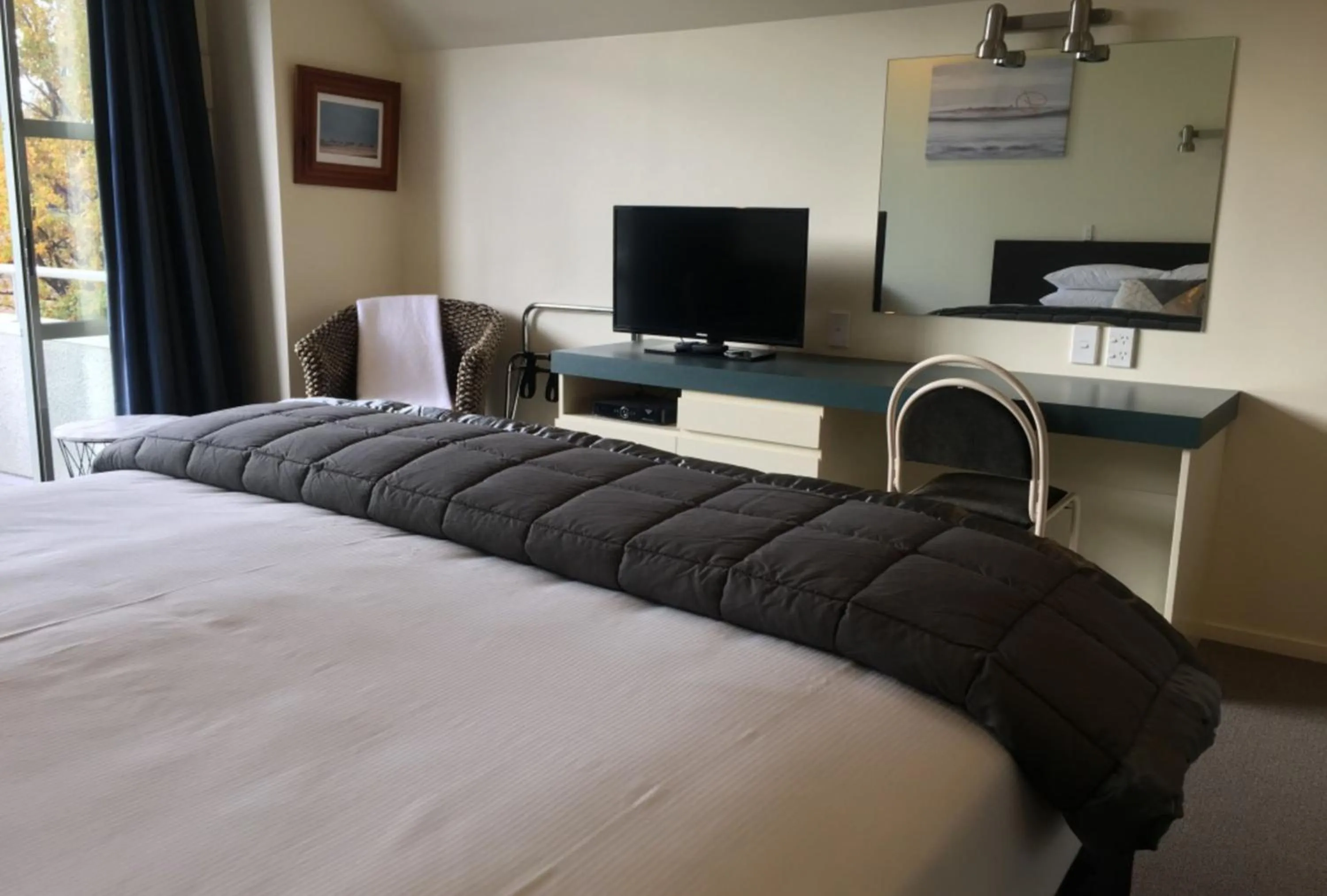 Bed in Colonial Manor Motel