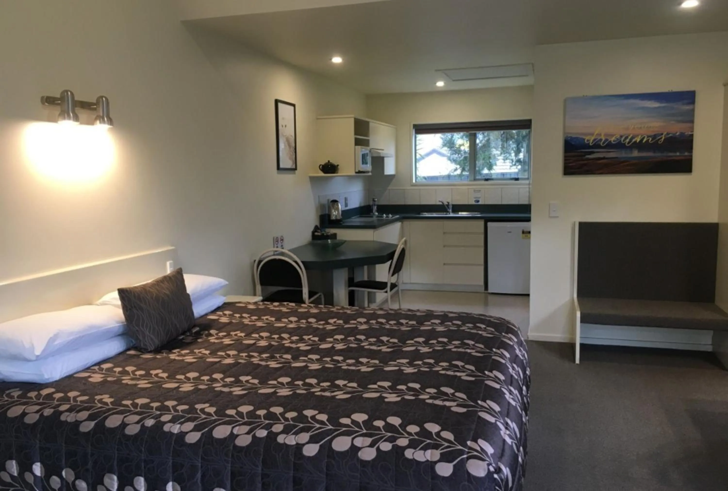 Bed in Colonial Manor Motel