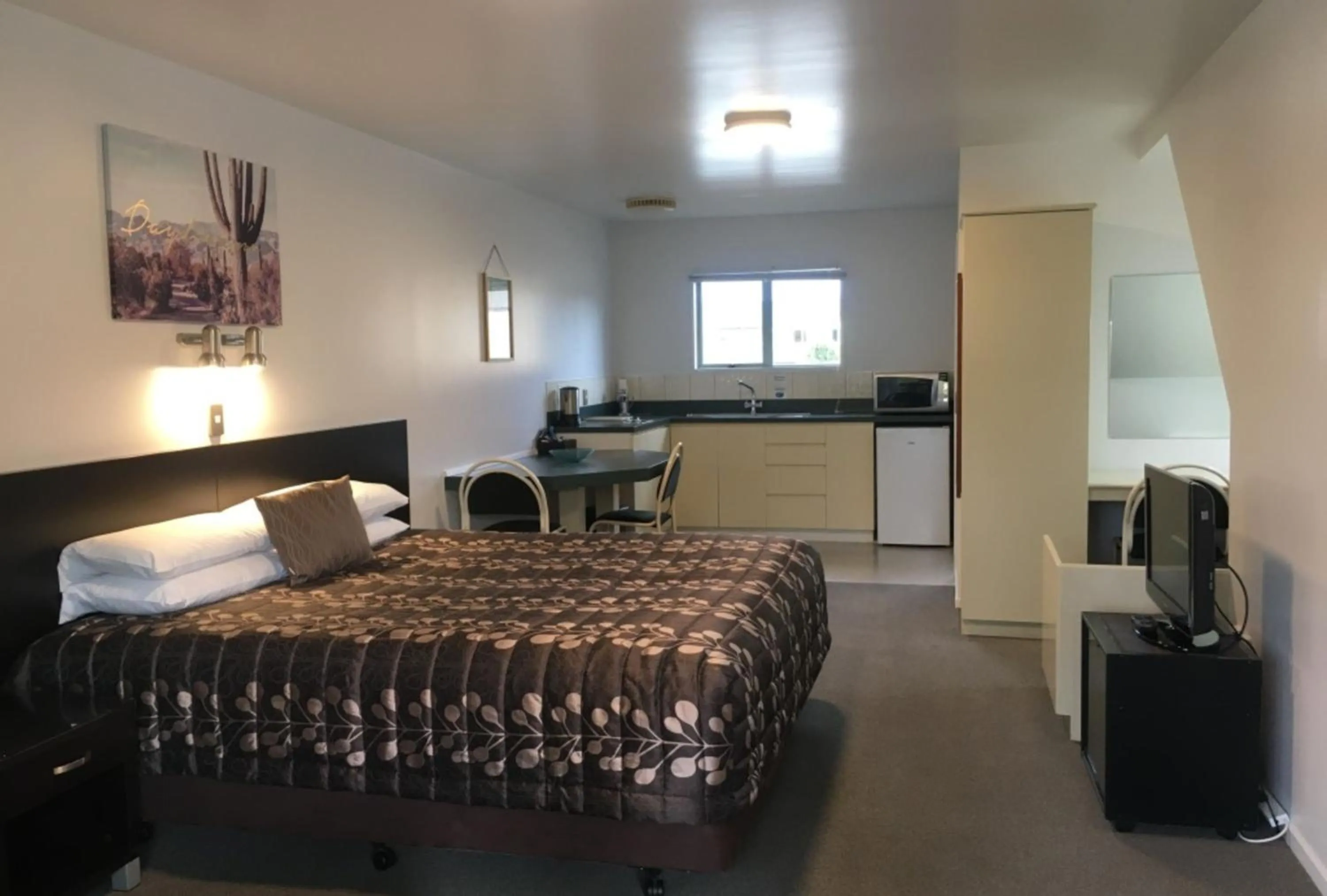 Bed in Colonial Manor Motel