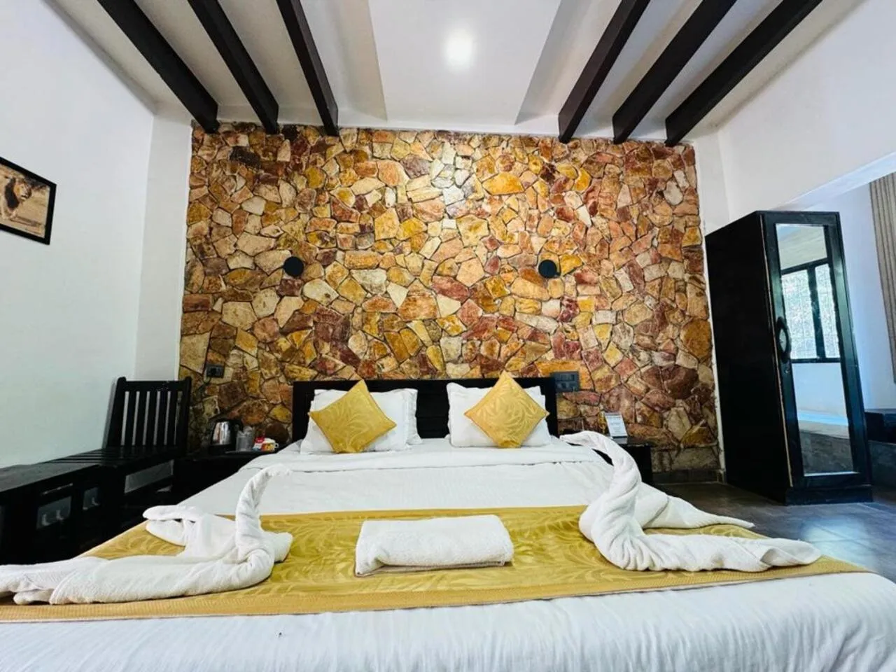 Bed in Gir Lions Paw Resort with Swimming Pool