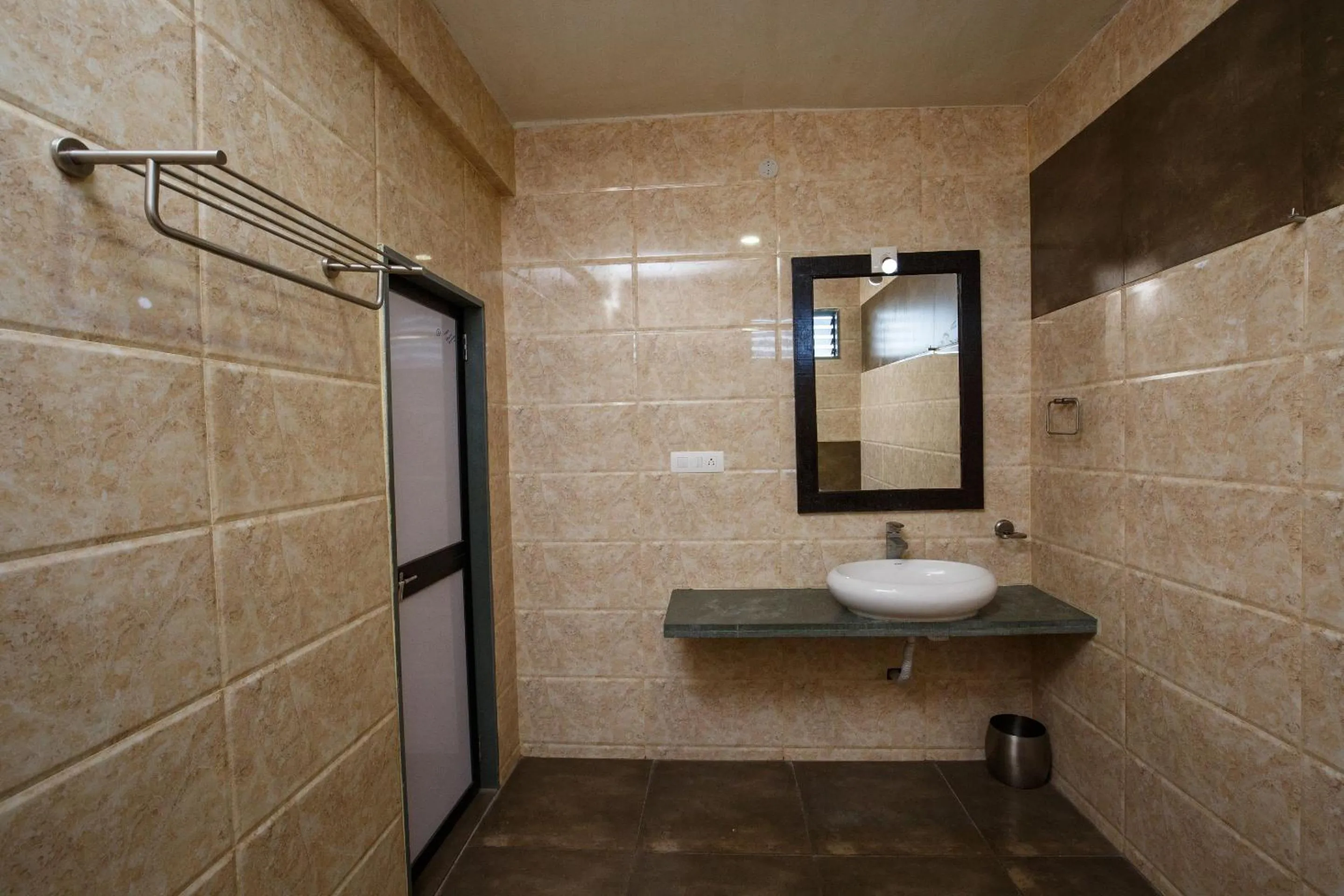 Bathroom in Gir Lions Paw Resort with Swimming Pool