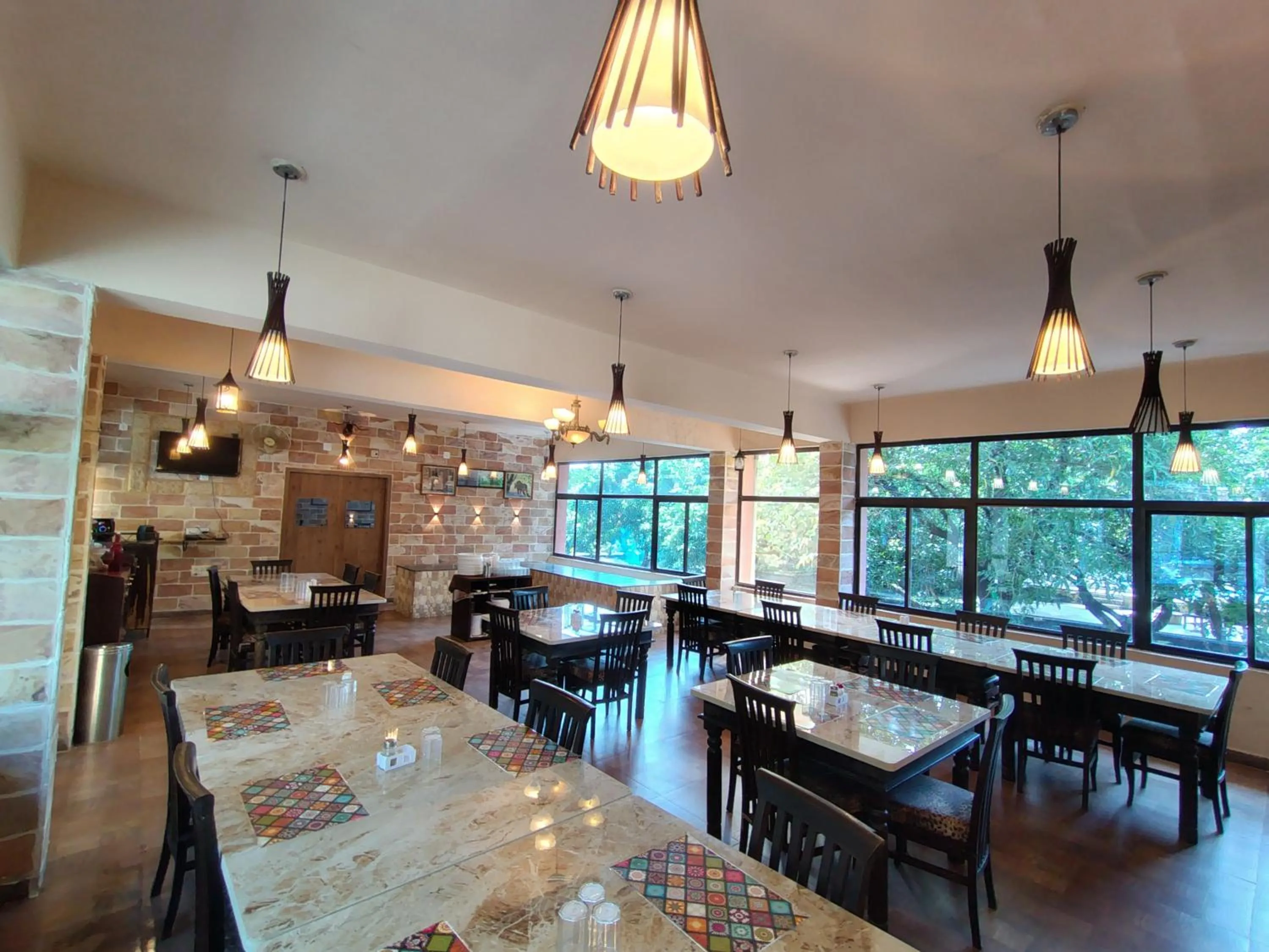 Restaurant/places to eat in Gir Lions Paw Resort with Swimming Pool