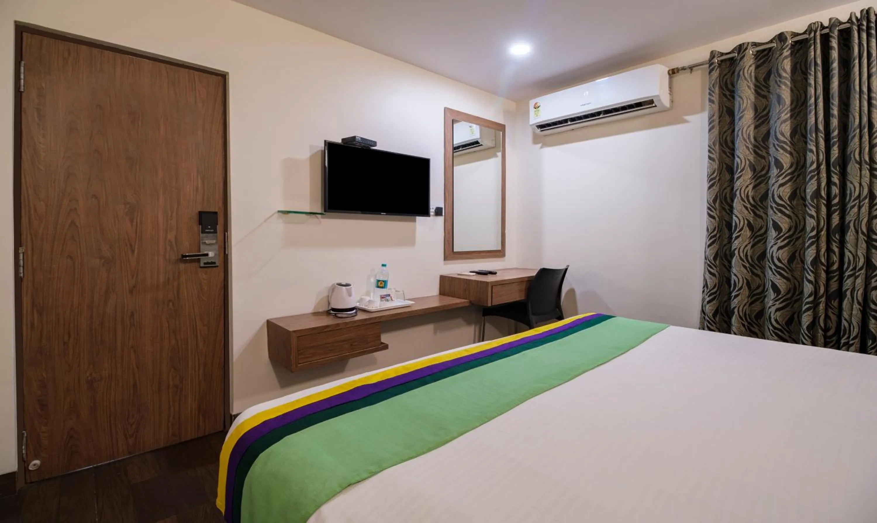 Bedroom, Bed in Treebo MVP Grand