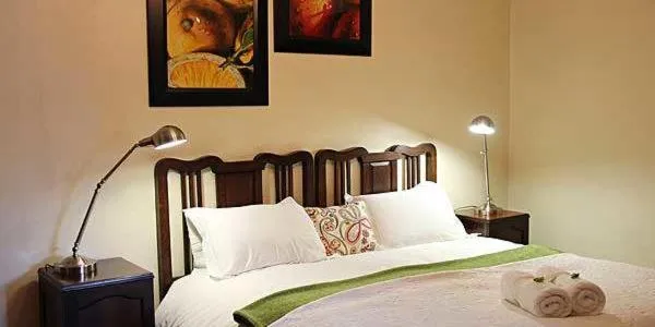 Bed in Greenleaf Guest Lodge