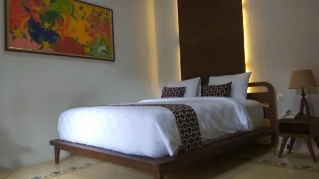 Bed in Joglo Mandapa Boutique Hotel