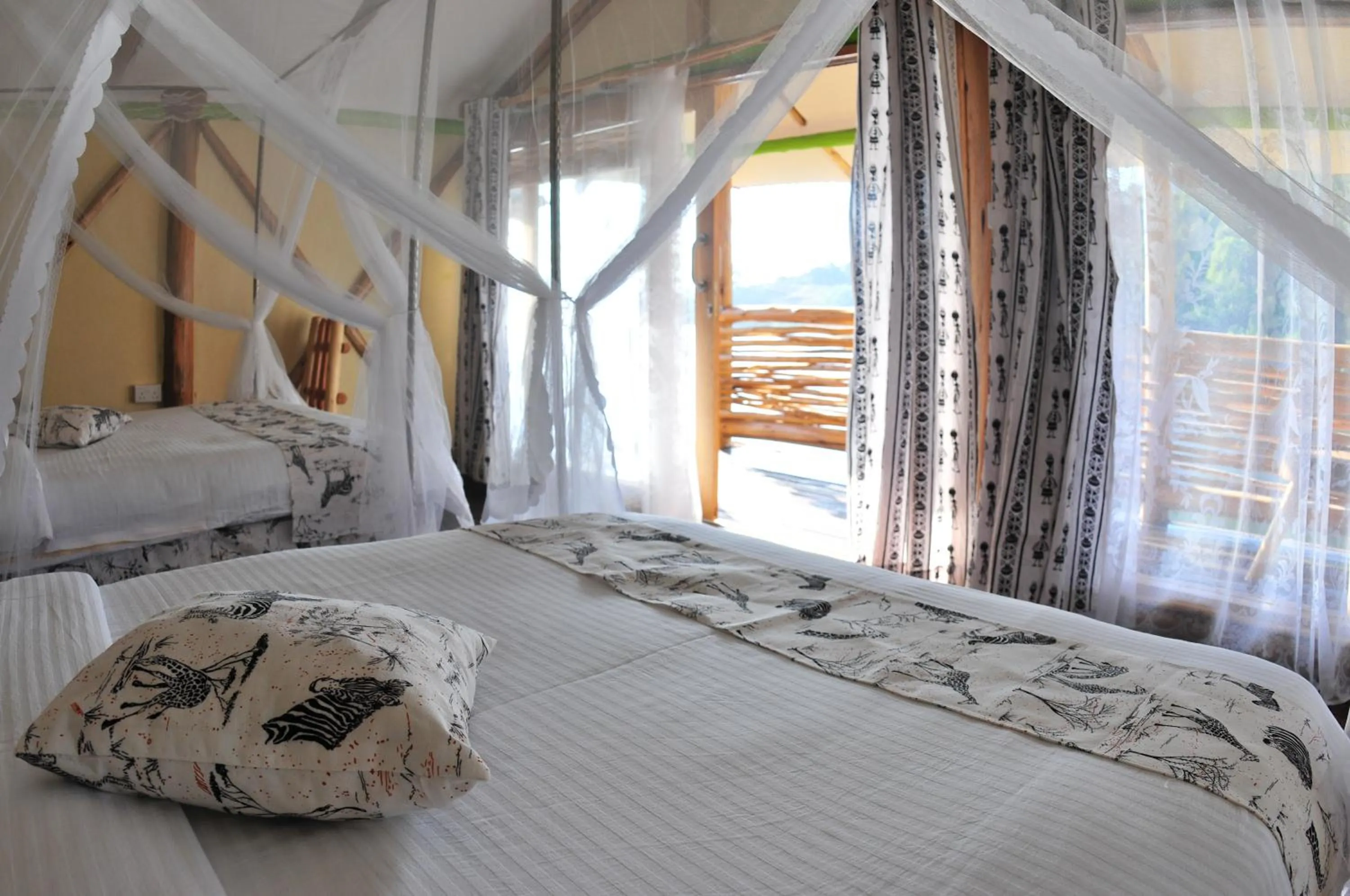 Bed in Lake Bunyonyi Rock Resort