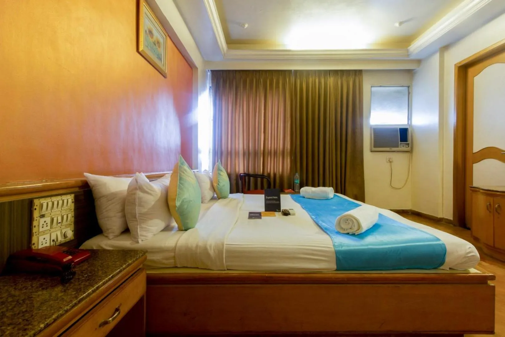 Bedroom, Bed in Celebrations Inn Pune