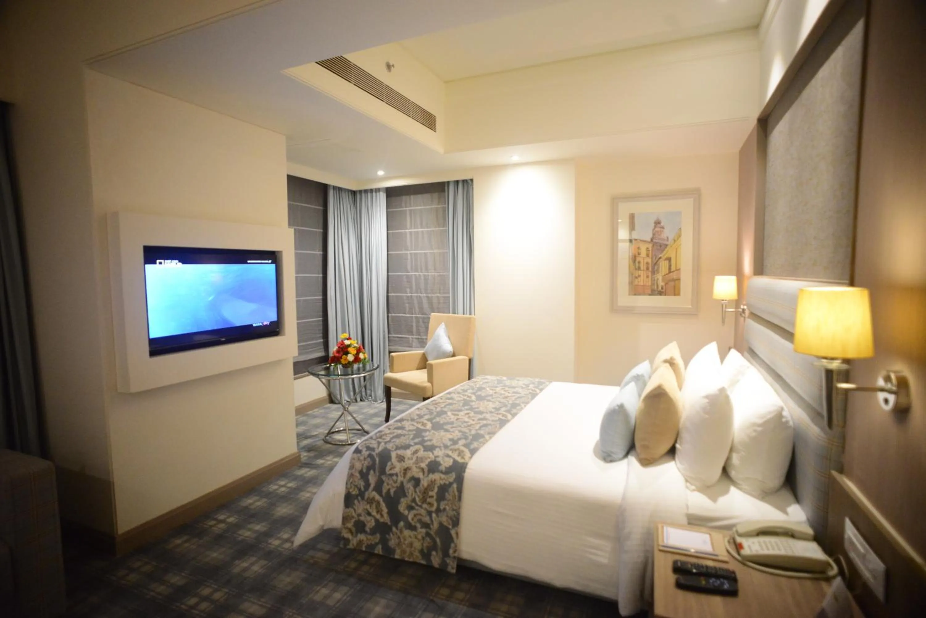 Bedroom, Bed in Efcee Sarovar Premiere Bhavnagar