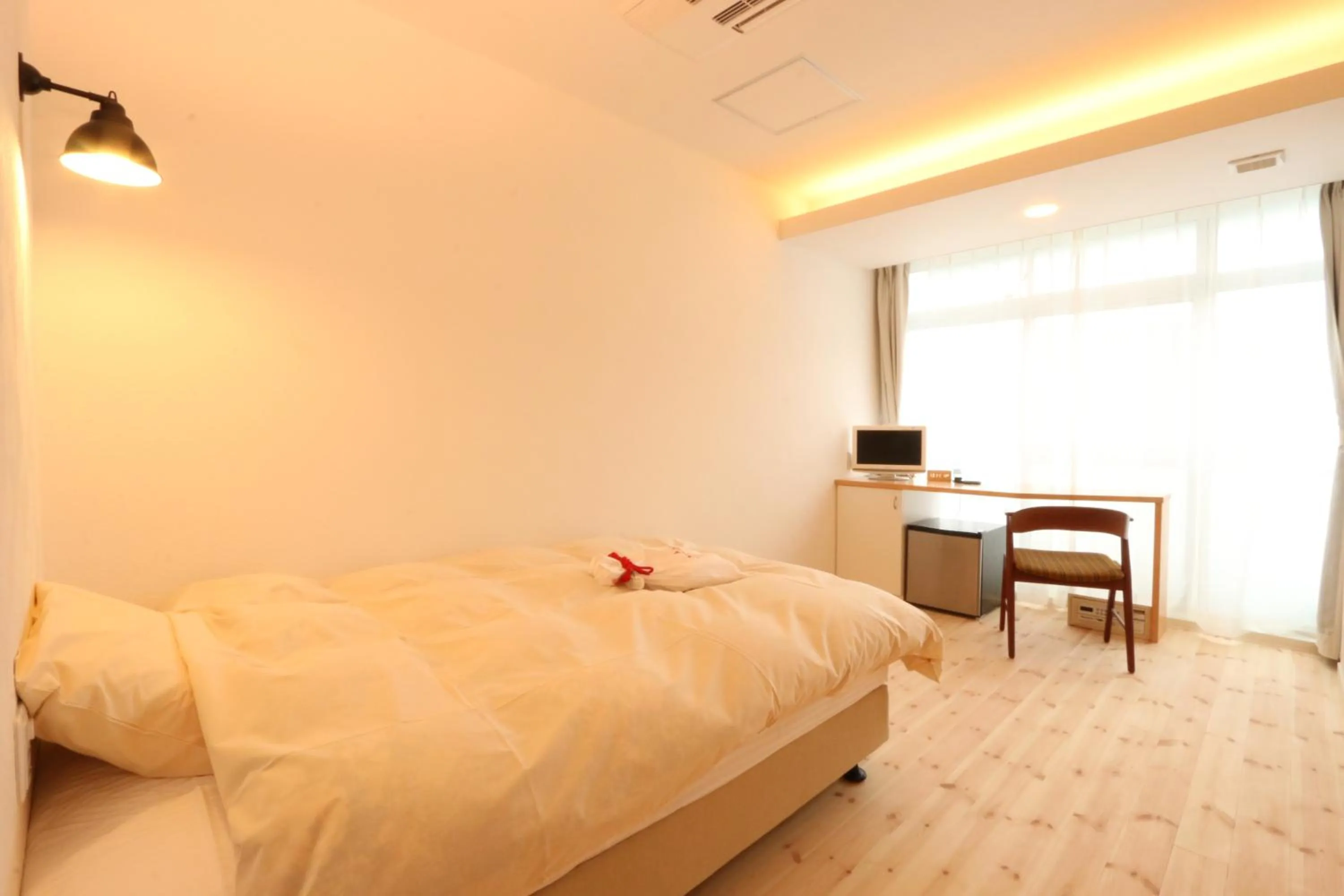 Bed in Amakusa Santacoming Hotel