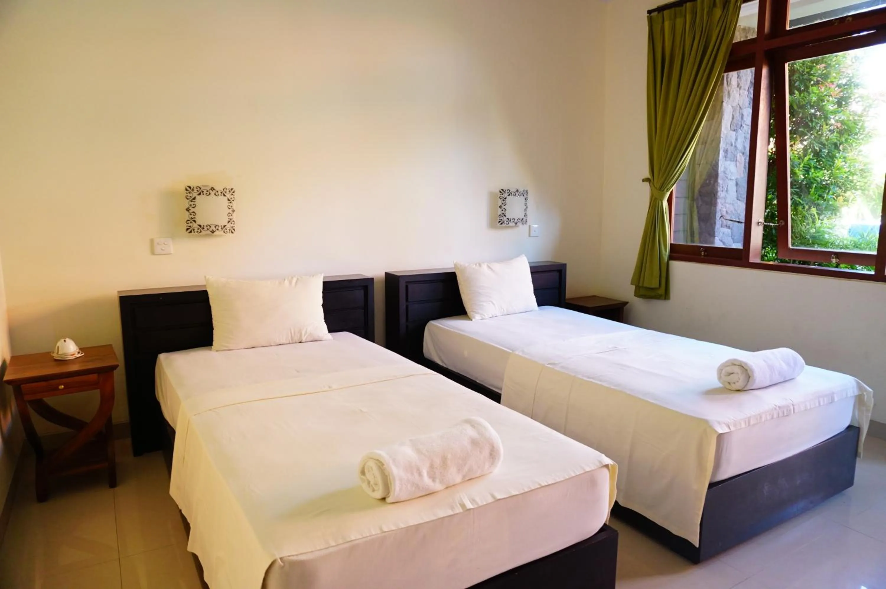 Bed in Yulia 2 Homestay Sanur