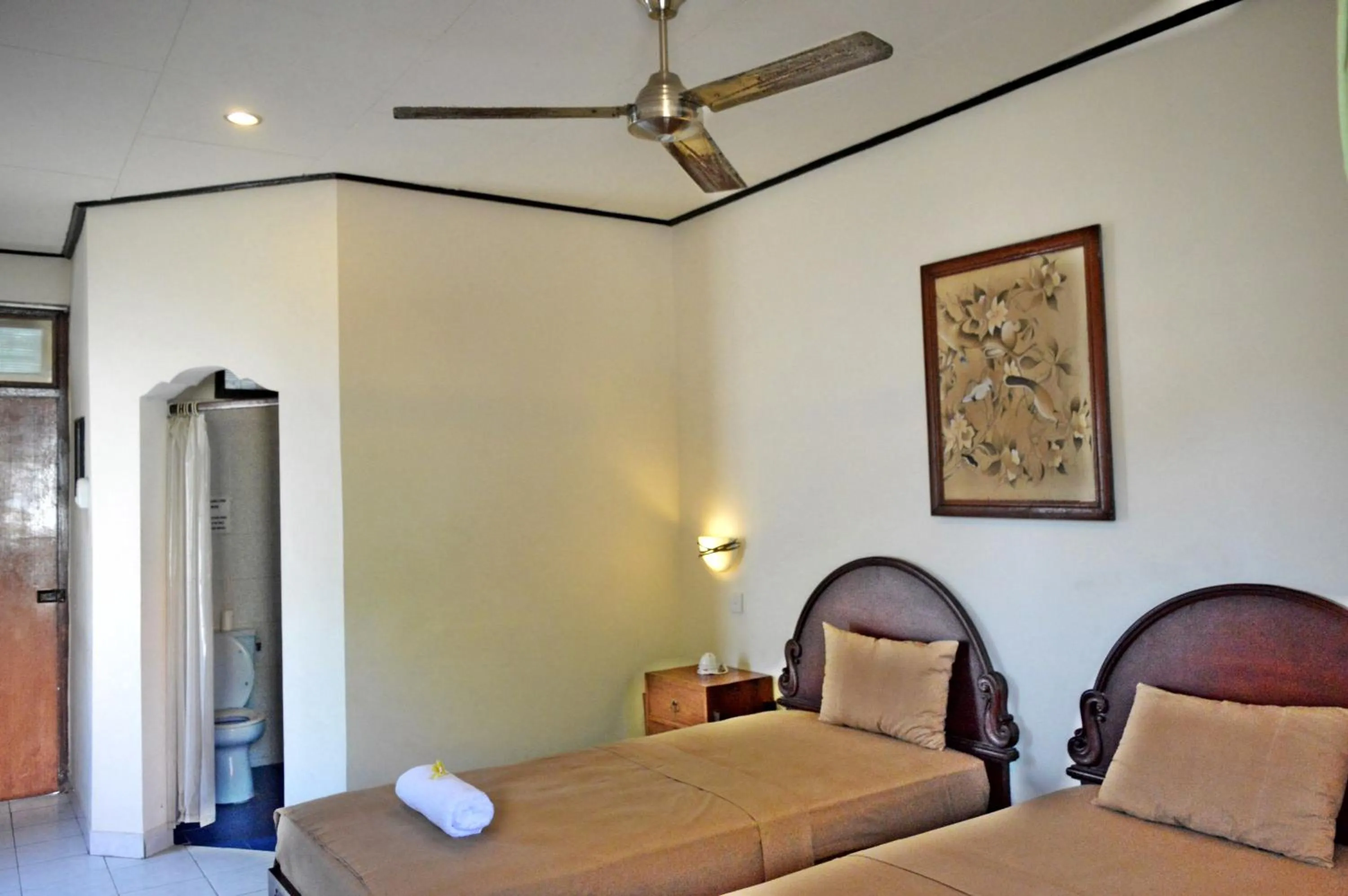 Bed in Yulia 2 Homestay Sanur