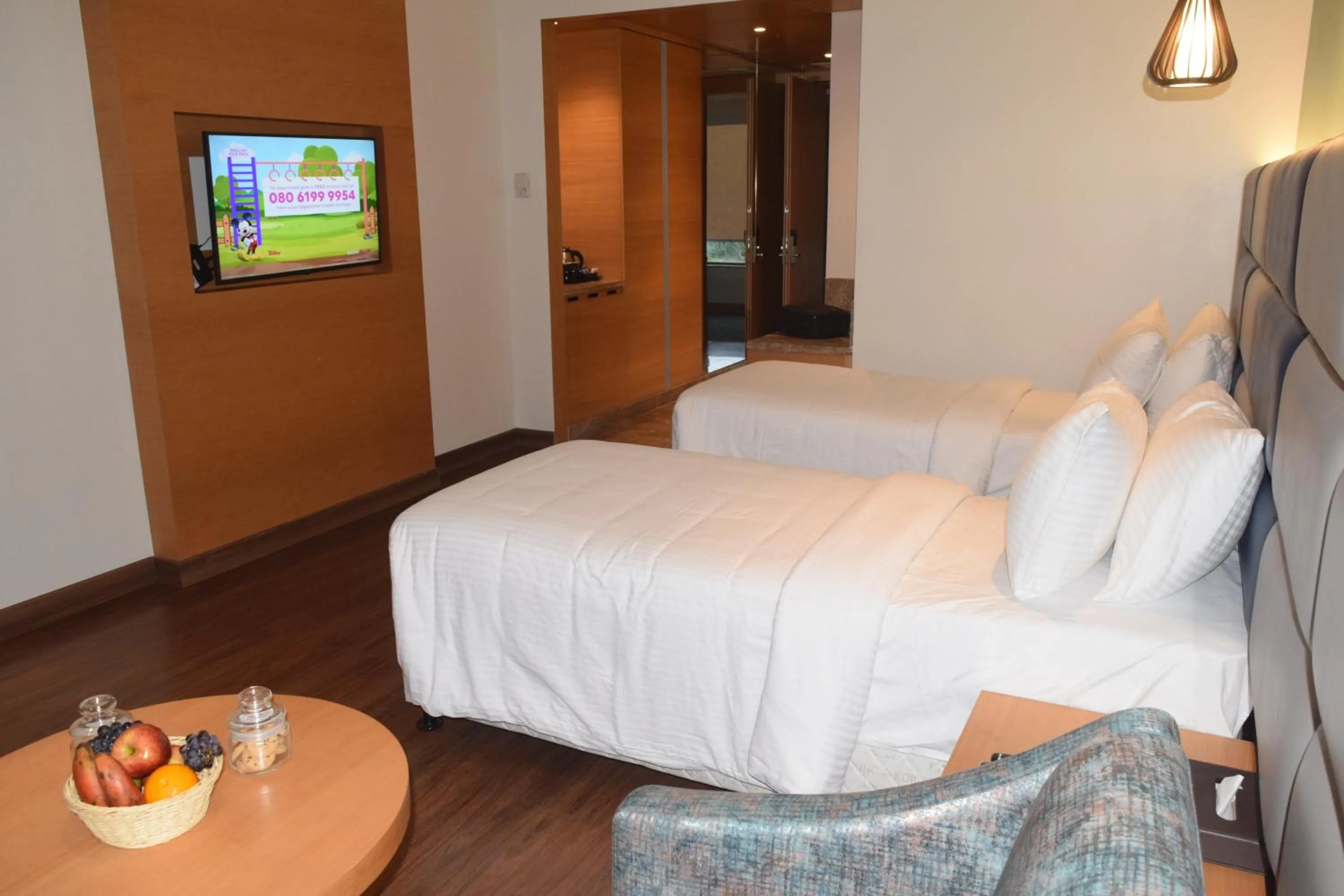 Photo of the whole room, Bed in SRM Hotel Maraimalai Nagar Chennai