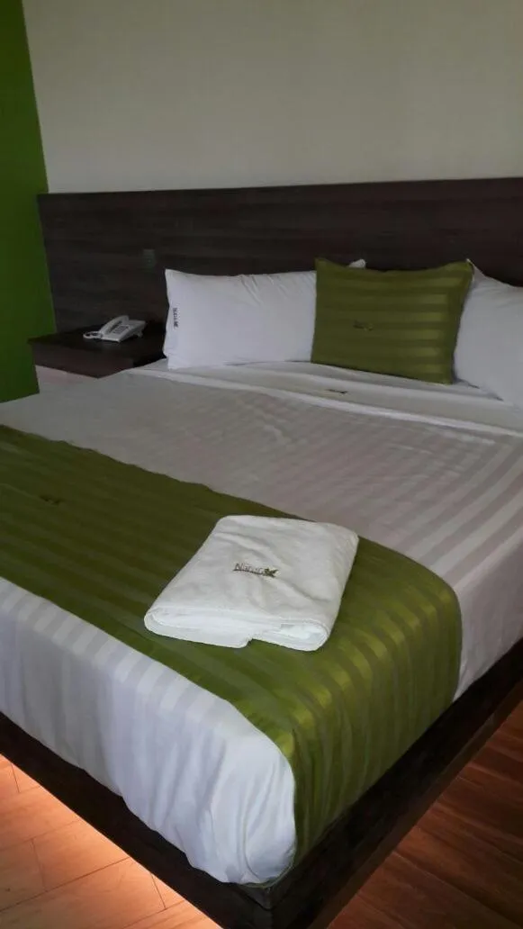 Bed in Hotel y Villas Natura