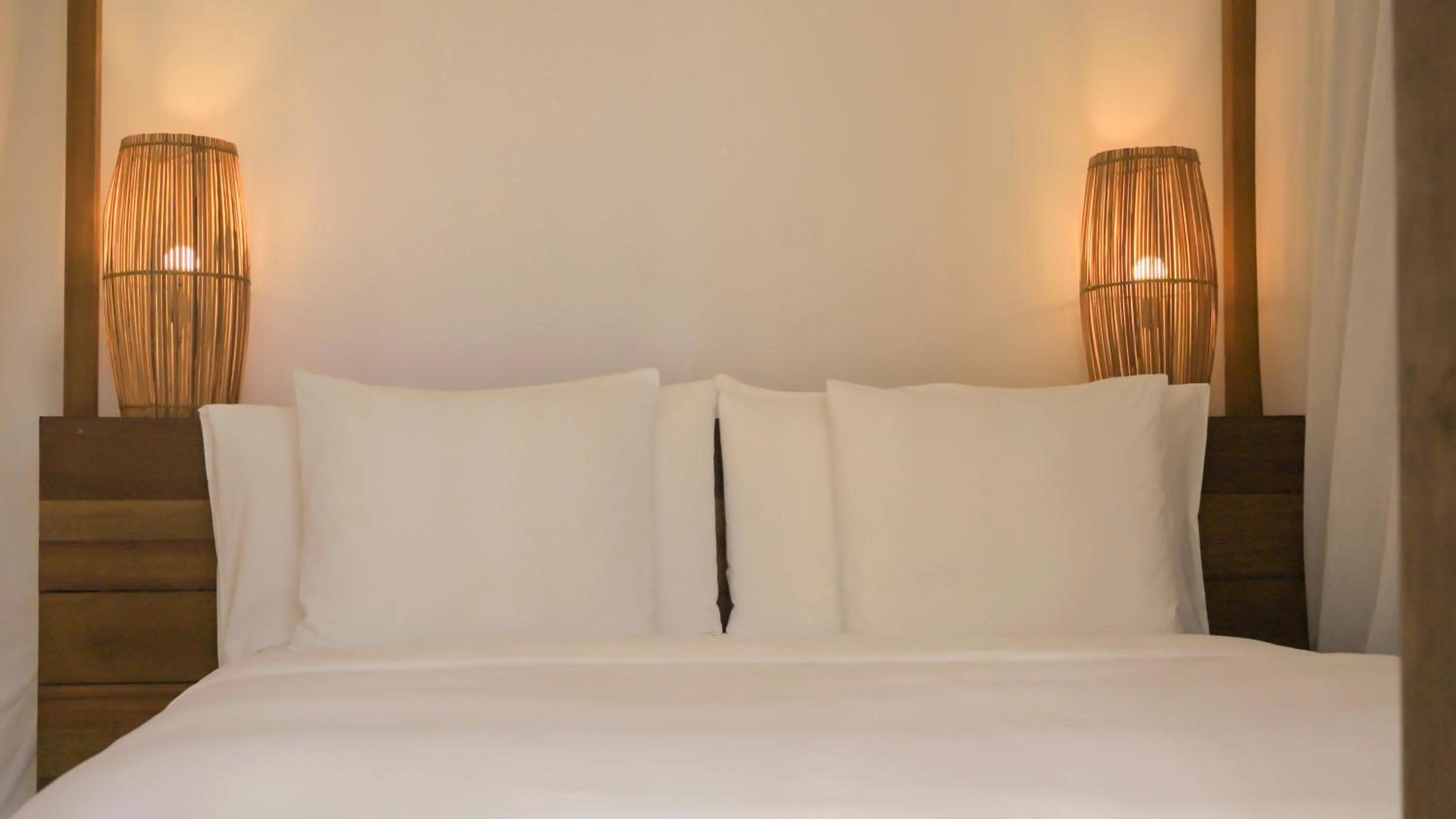 Bed in KA BRU Beach Boutique Hotel
